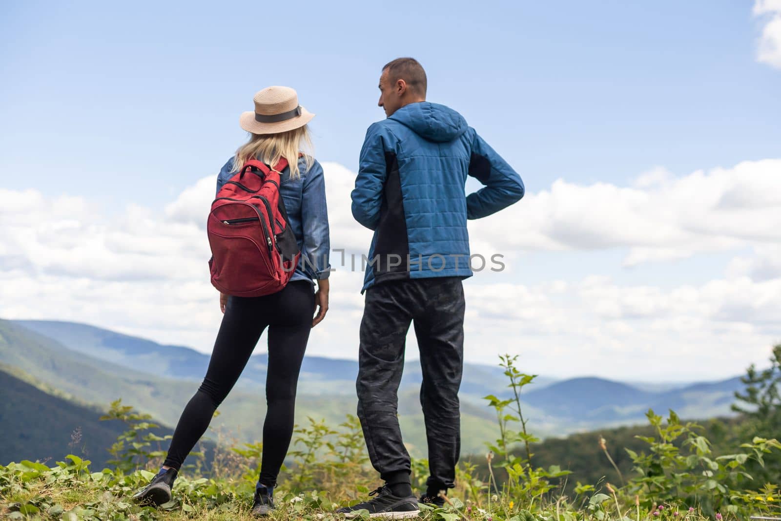 beautiful young couple enjoying nature at mountain.