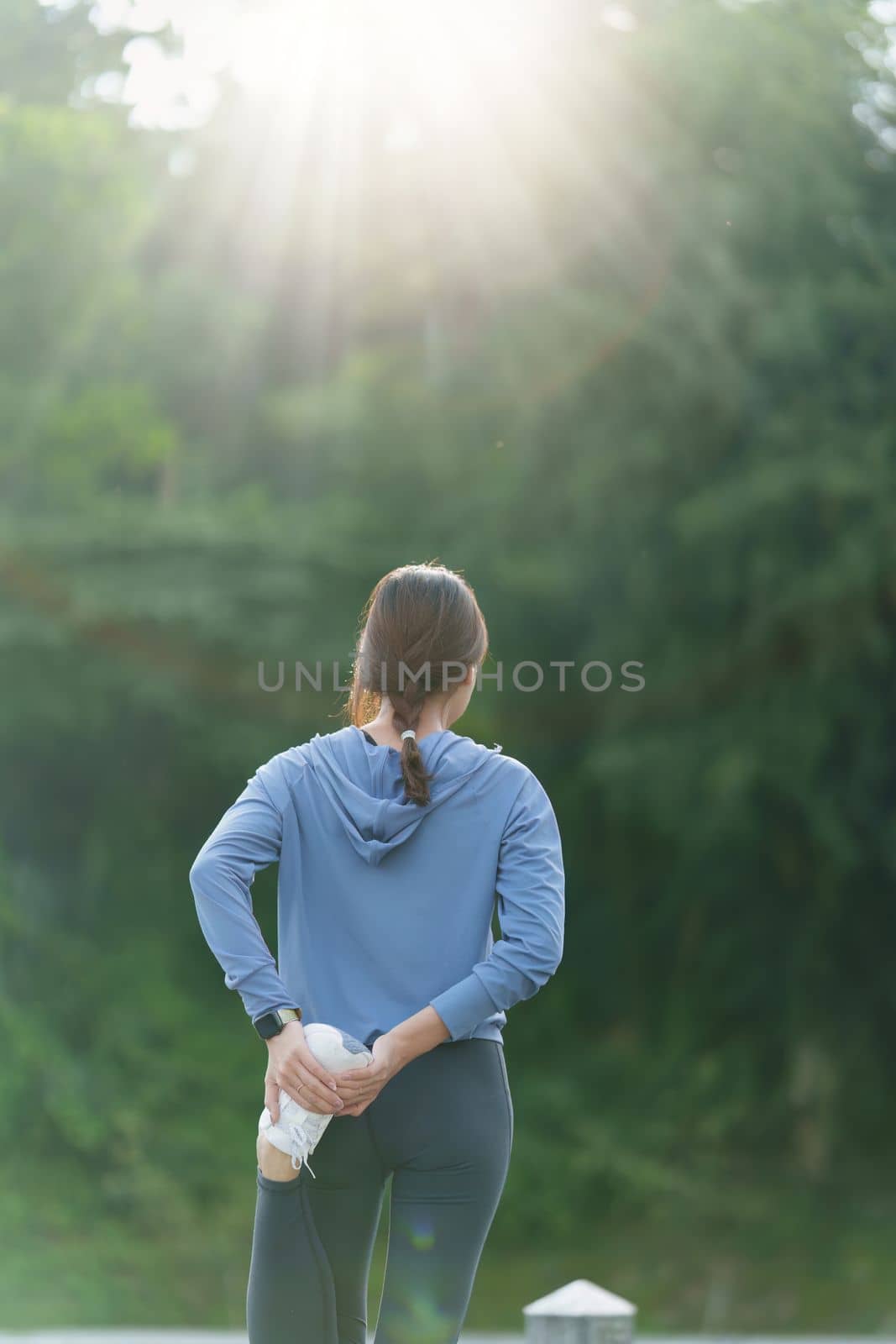 Healthy Asian woman is jogging outdoor. Fitness girl running. Female exercising at outdoor park.