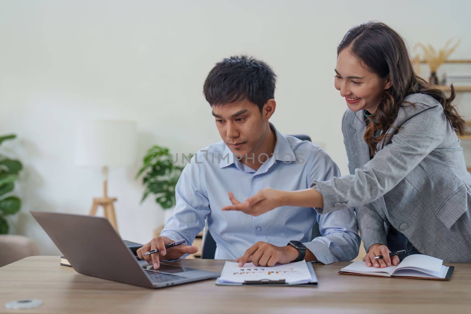 Financial analyst analyzes business people investment consultant analyzing company financial report working with documents graphs. Stock Market Tax Fund Finance concept.