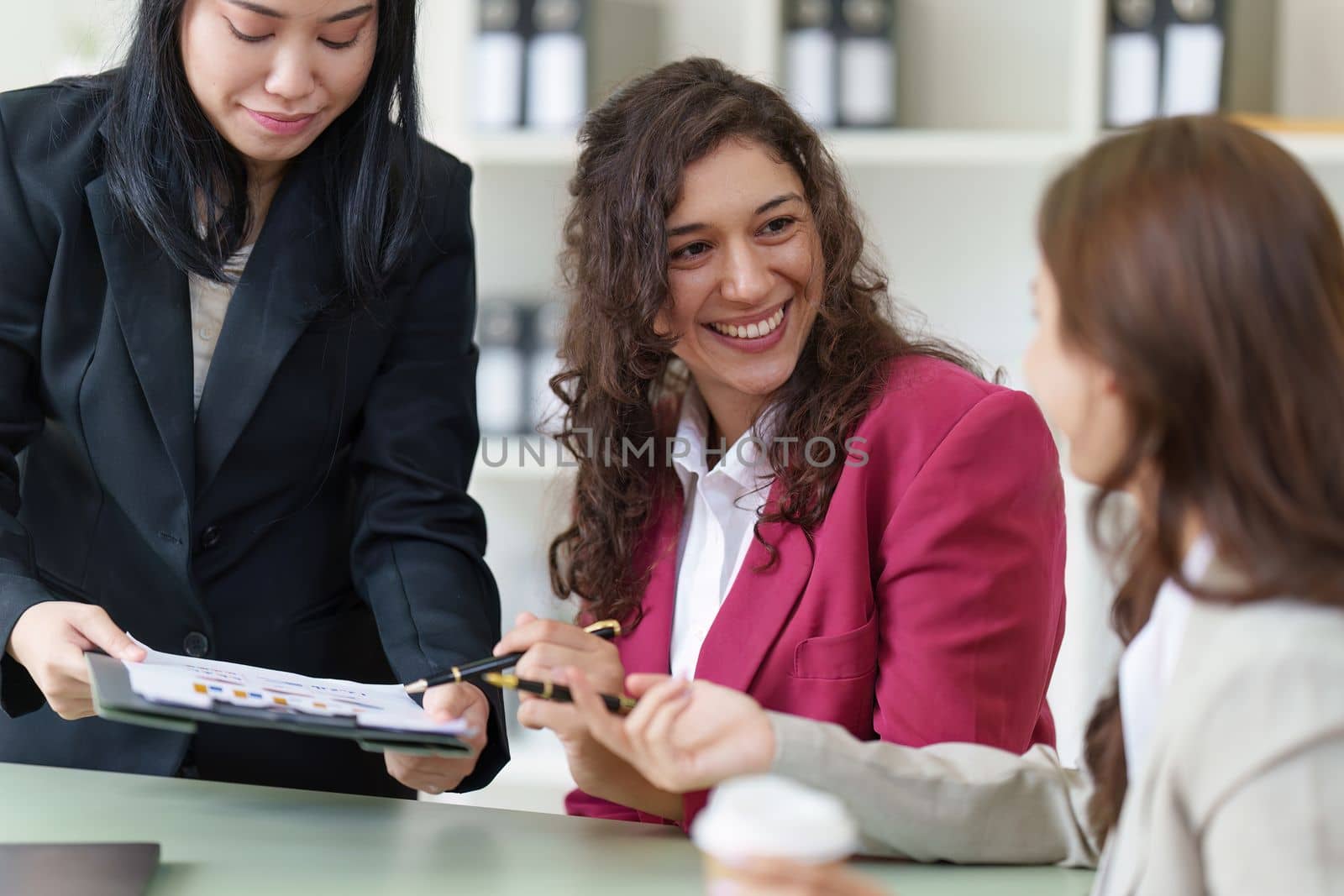 Business People Meeting to discuss and brainstorming the financial report paperwork in home office. Financial advisor teamwork and accounting concept.