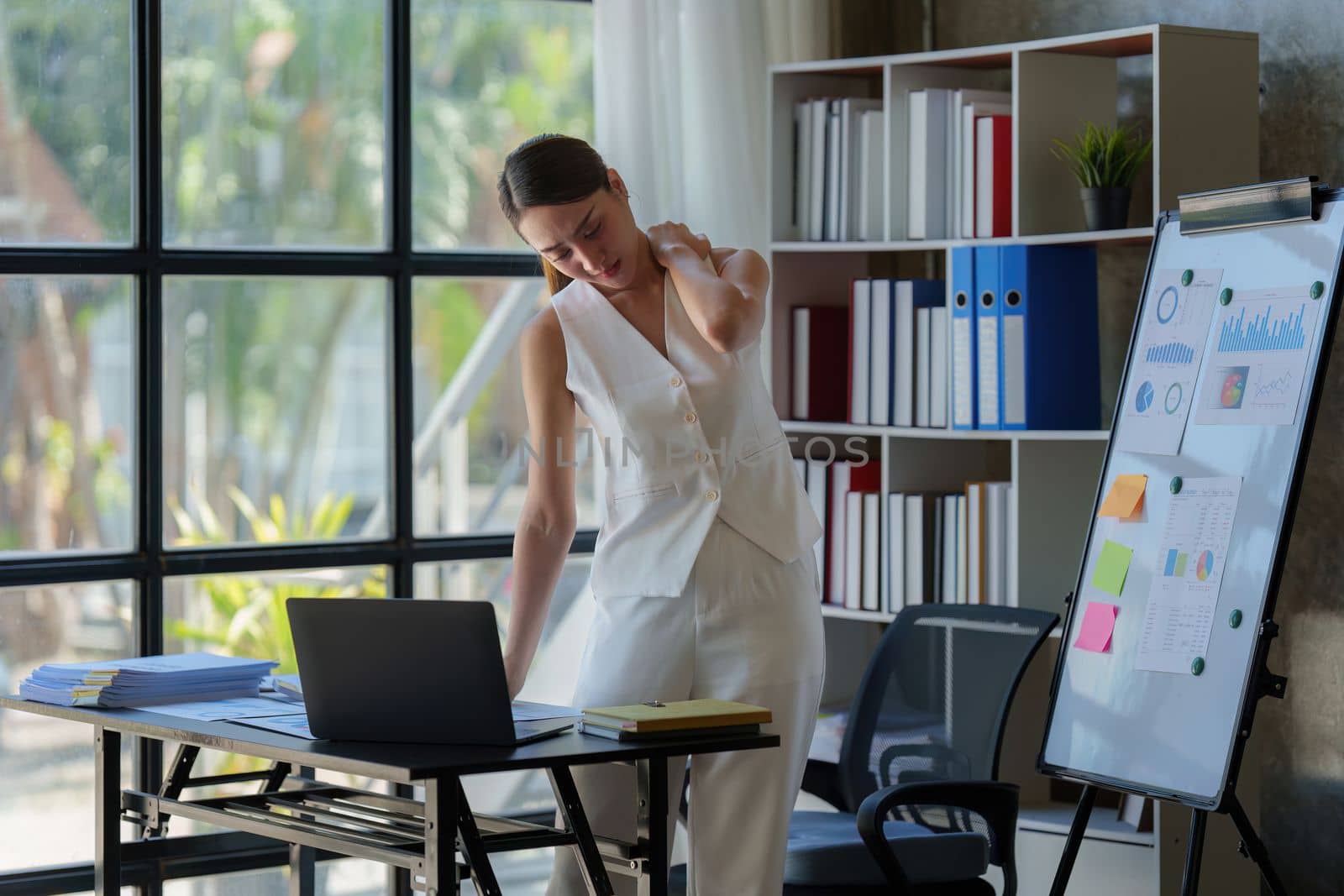 Asian Business woman working and relaxing at home office and analyze financial report document. Accounting and Finance concept.