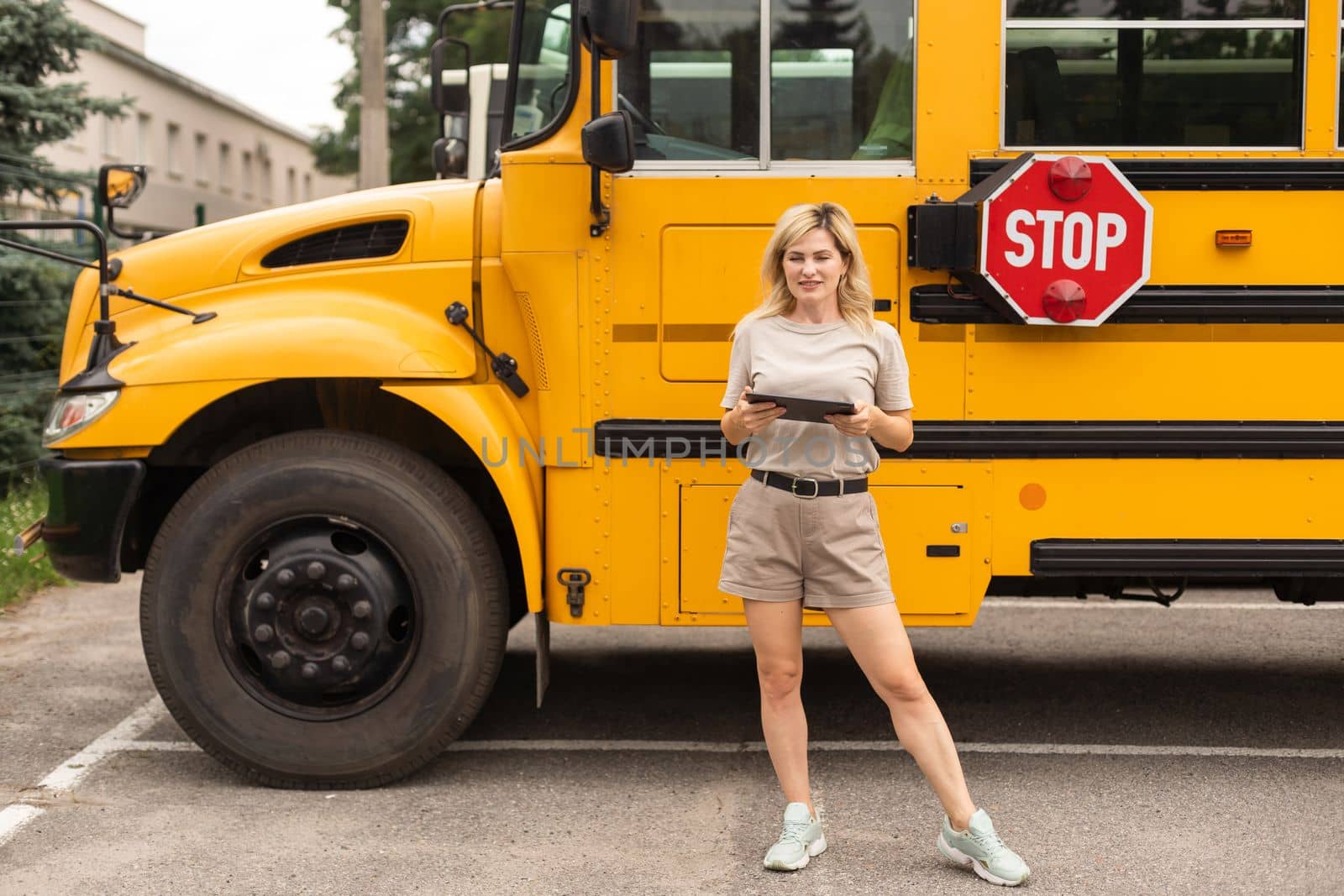 a woman near a school bus.