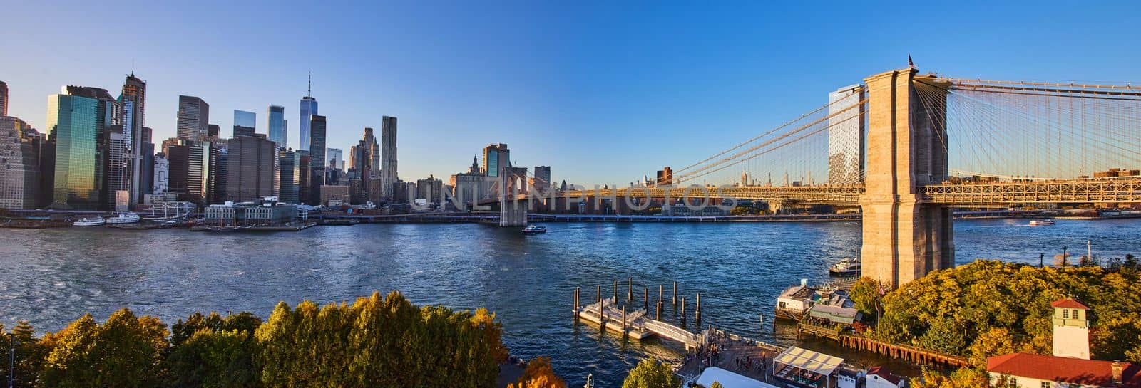Image of Panoramic high view over Brooklyn New York City with bridge and city skyline at sunset