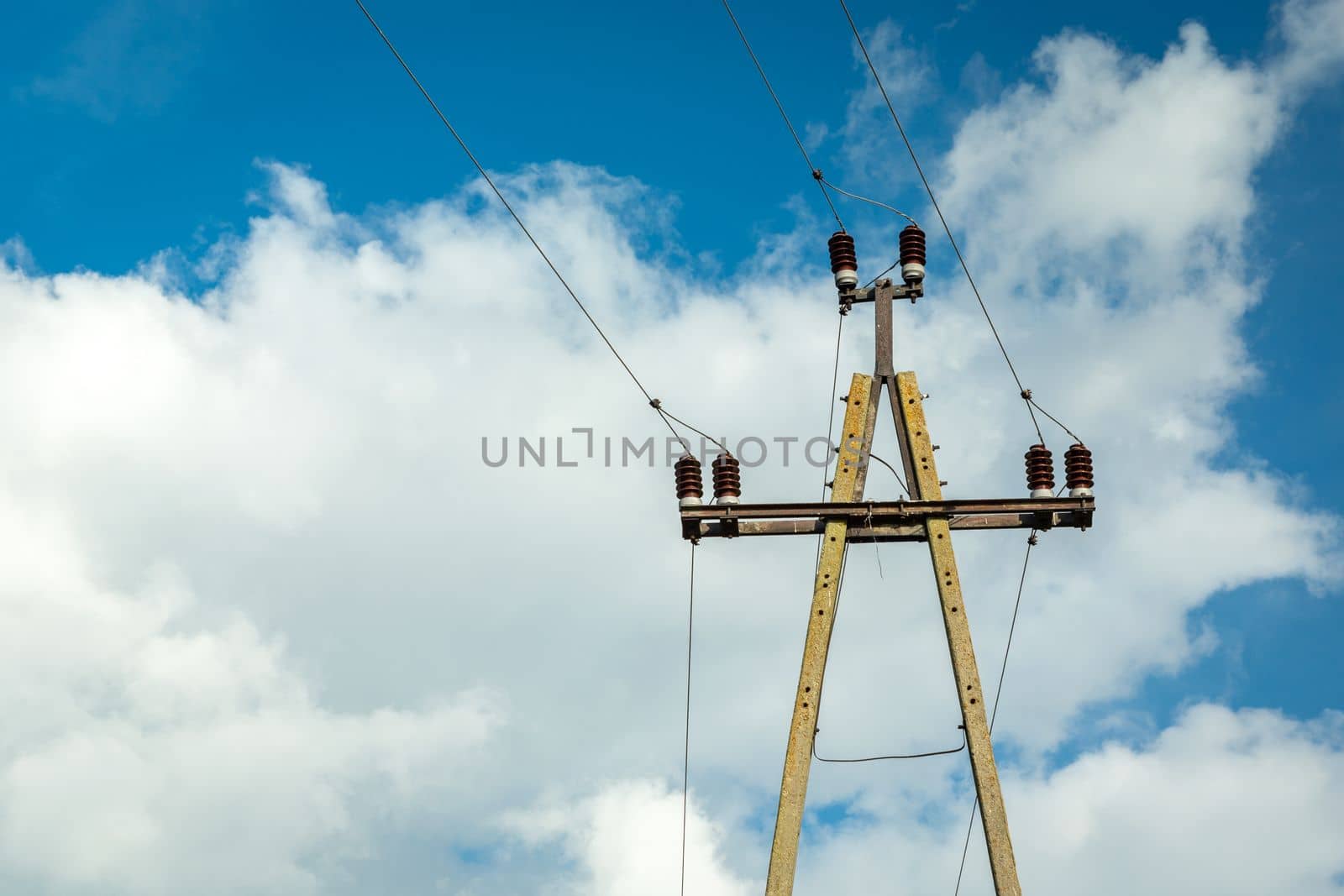 Single concrete electric pole with ceramic insulators and wires