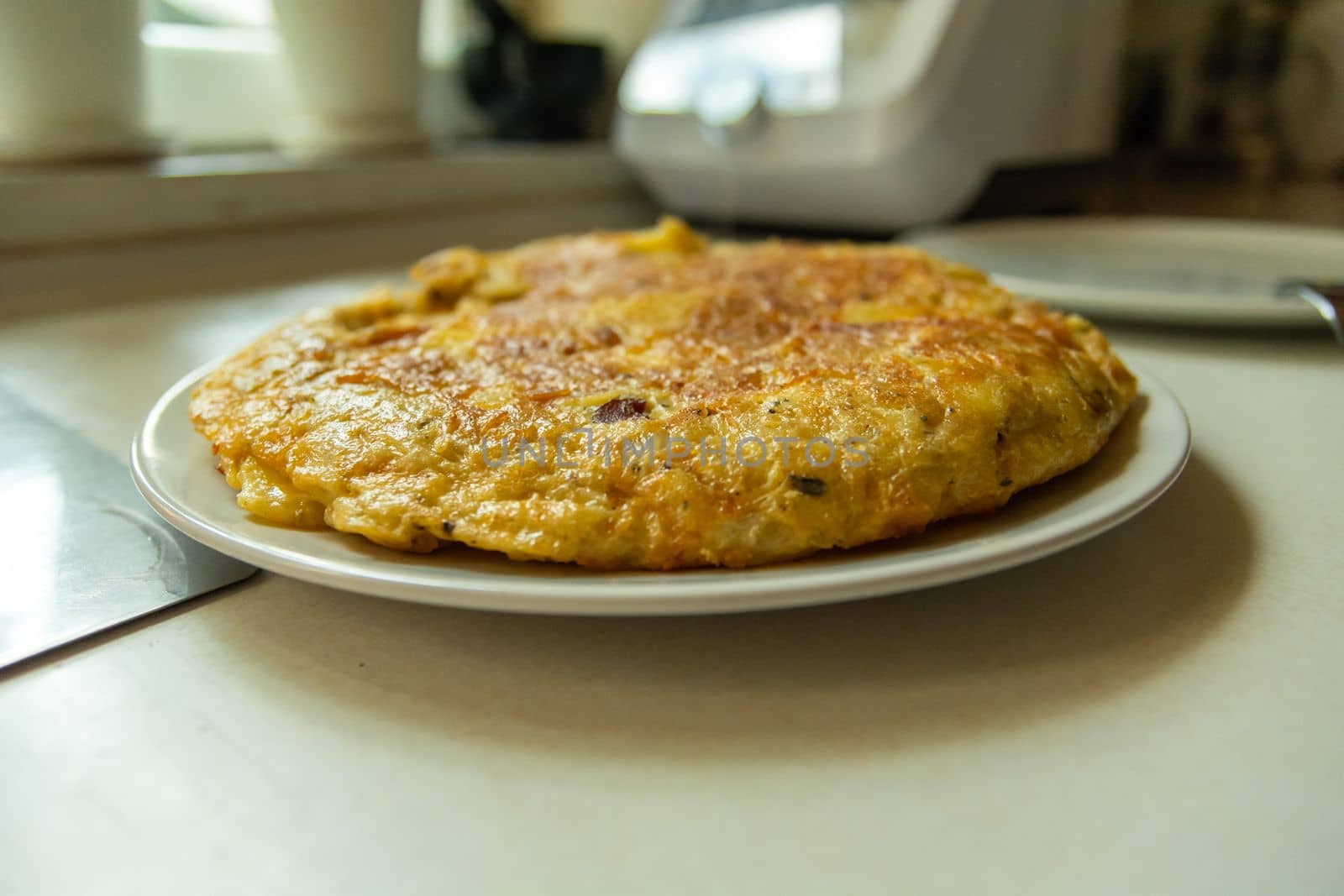 Traditional Spanish tortilla on a plate, prepared at home by darekb22