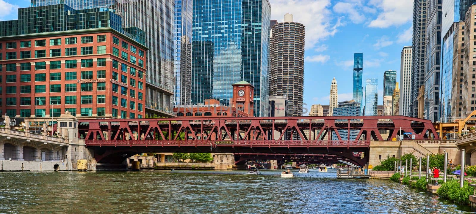 Image of Wells Street bridge going over river in Chicago with skyscrapers all around