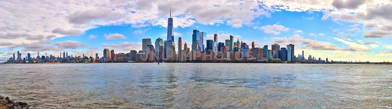 Full stunning New York City skyline on sunny morning from New Jersey with choppy waters by njproductions