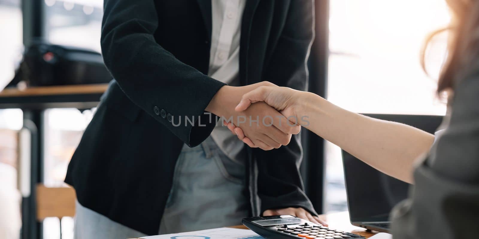 Business people shaking hands, finishing up meeting.