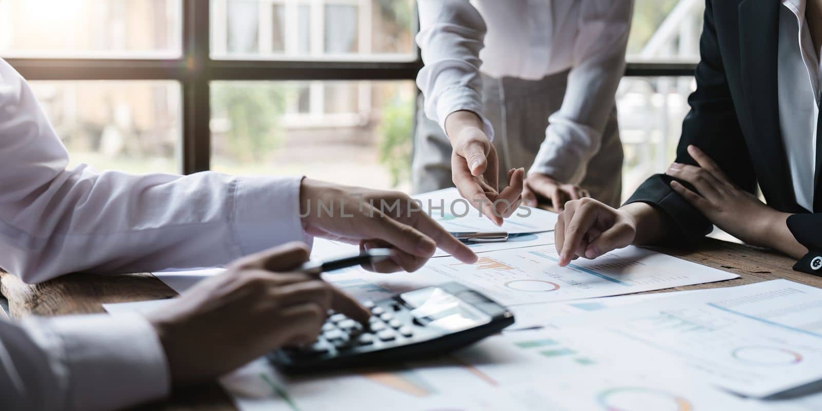 Business teamwork hands, paperwork graphs and planning annual report data, research and office budget. Company discussion with documents in strategy meeting, analytics progress and financial stats.