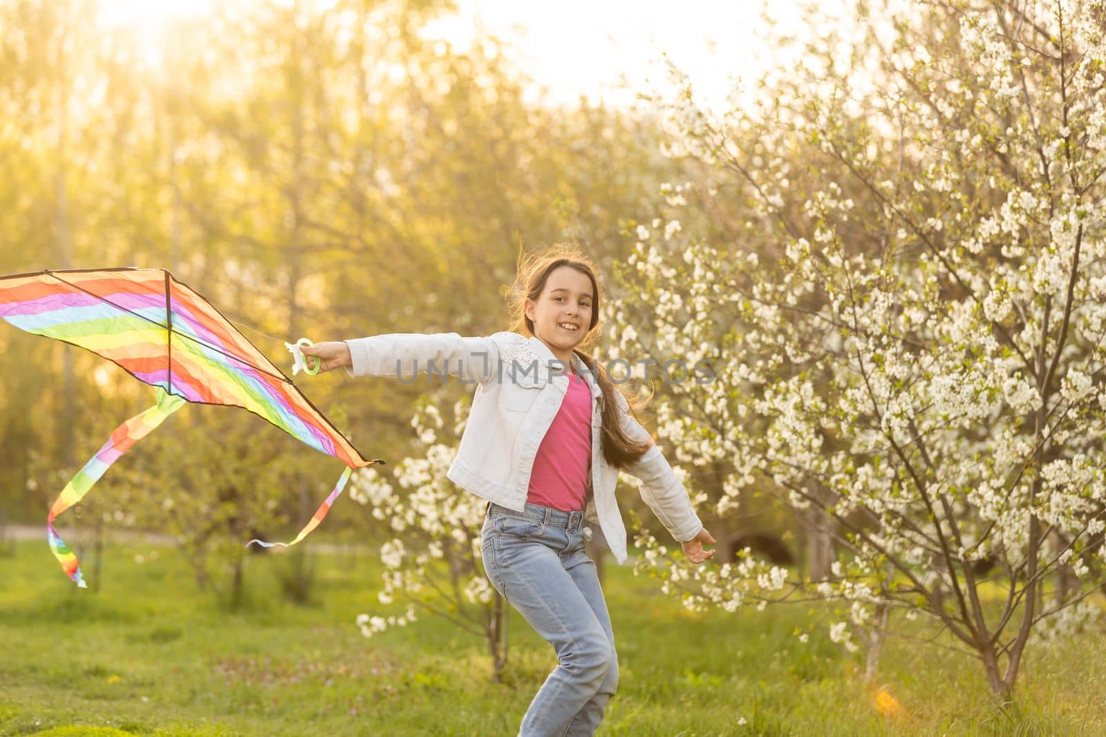little girl with a kite in the spring. Childhood, Children's Day.