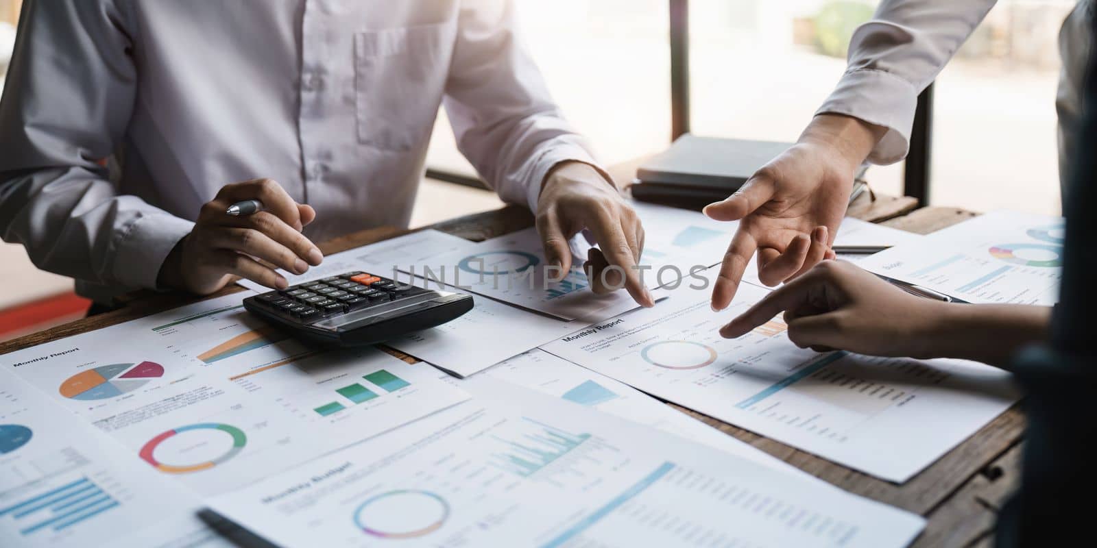 Business teamwork hands, paperwork graphs and planning annual report data, research and office budget. Company discussion with documents in strategy meeting, analytics progress and financial stats.