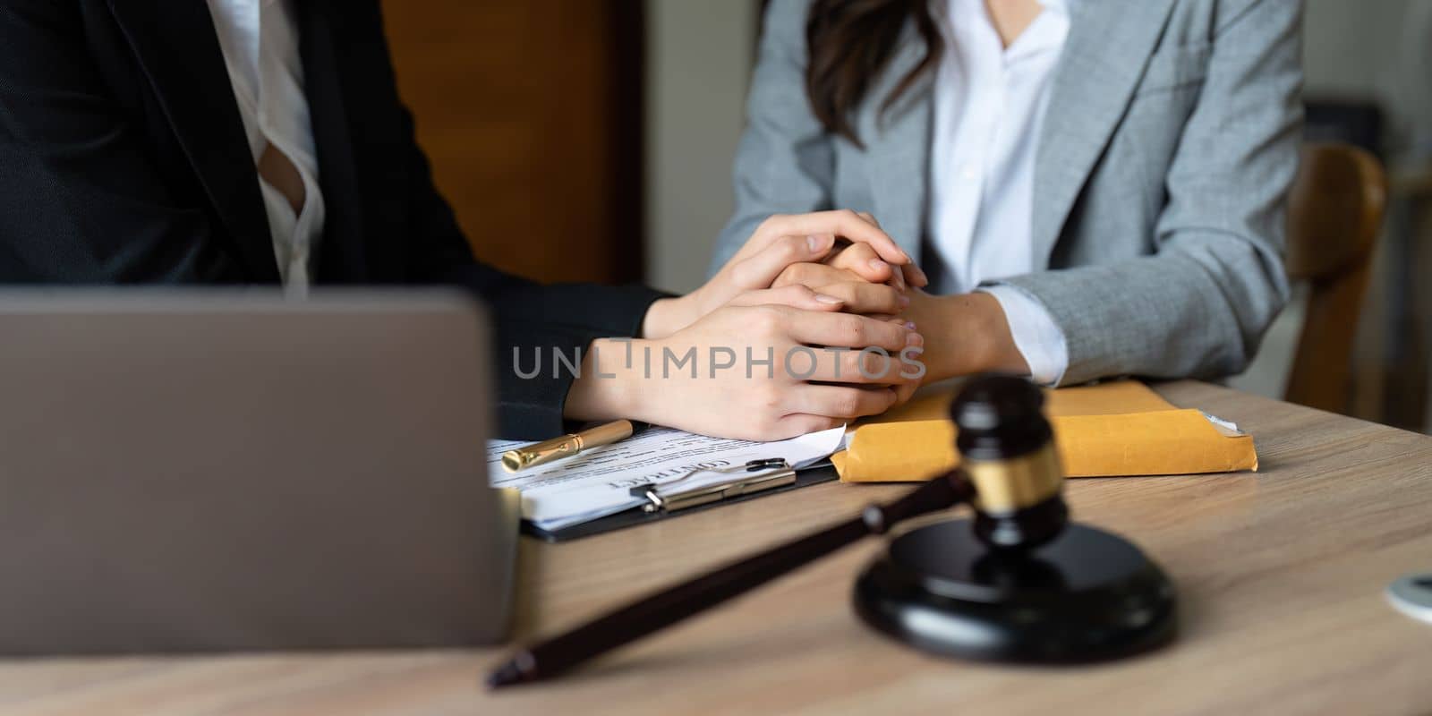 Justice and attorney concept. Lawyer meeting and consoling solution to his client provide legal advice and trust commitment strain serious for problem.