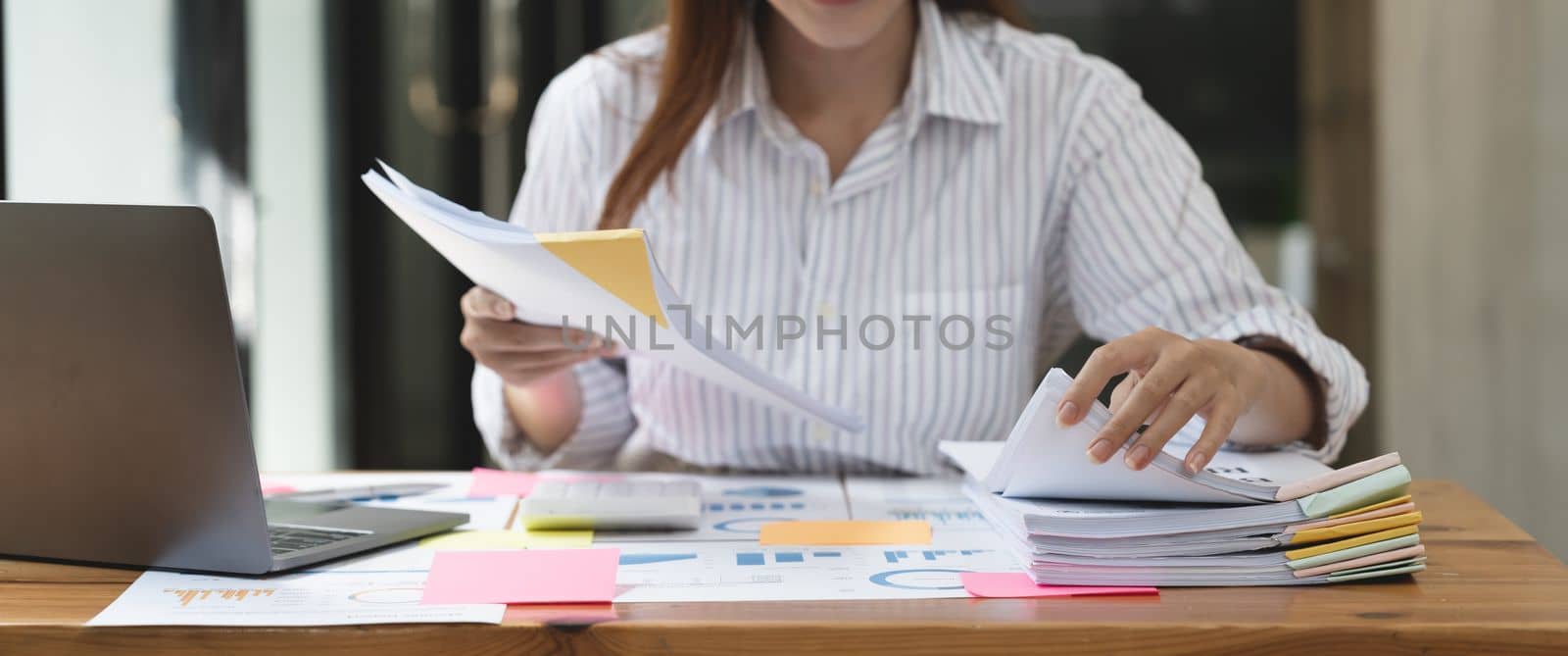 Tax accountant asian woman working with financial and paperwork