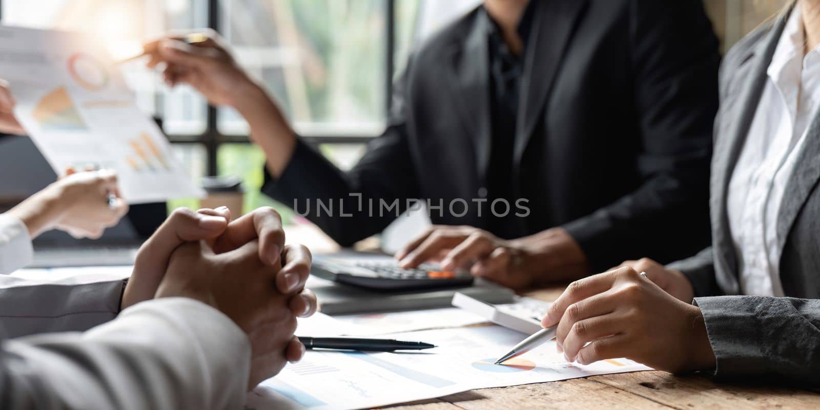 Startup business meeting to analyze and discuss the situation on the financial report in the meeting room. Investment Consultant, Financial advisor and accounting concept.