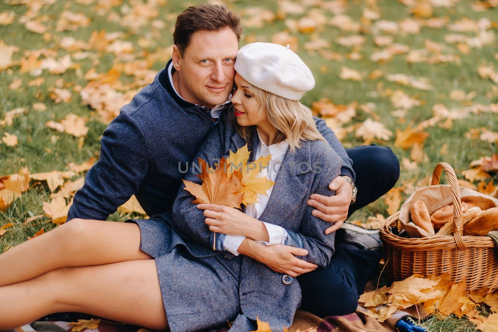 Happy couple enjoying golden autumn spring season in the park.