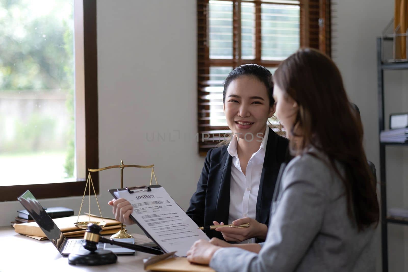 business people and lawyers discussing contract papers sitting at the table. Concepts of law, advice, legal services, legal and judgment concept by wichayada