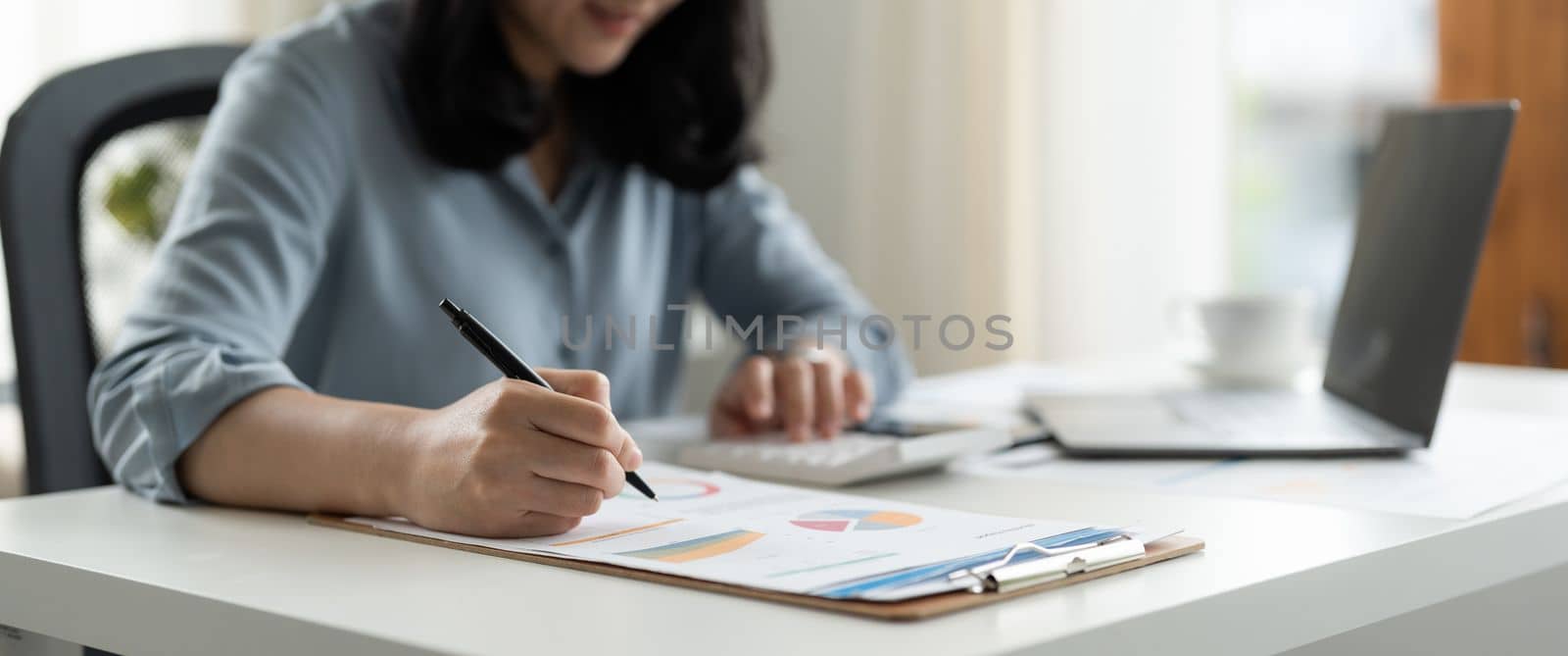 Business people or accountants are analyzing graphs on finance report, investment, graph chart business strategy ideas, data analysis technology. by nateemee