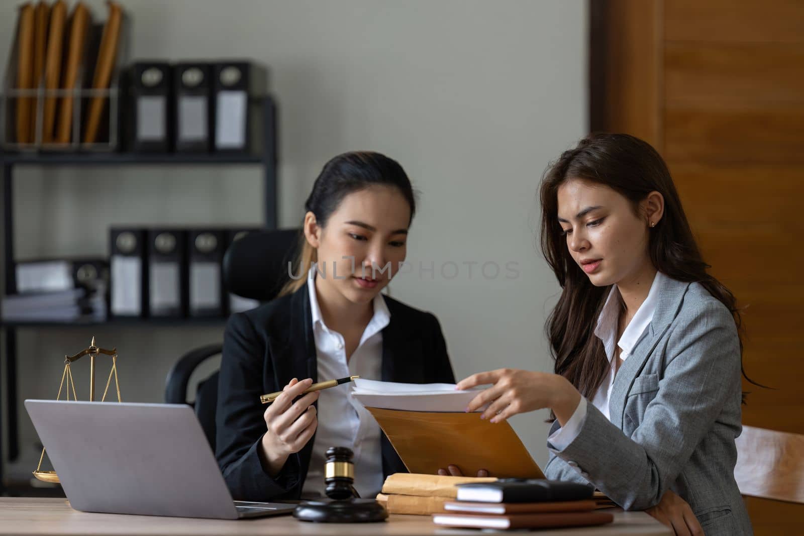 Businesswoman and female lawyer consult having team meeting with client, Law and Legal.