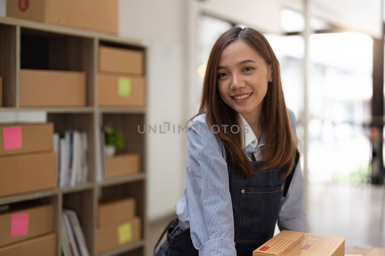 Portrait asian entrepreneur successful with her SME business. Online marketing packaging delivery, startup SME entrepreneur or freelance woman concept. Small business owner.