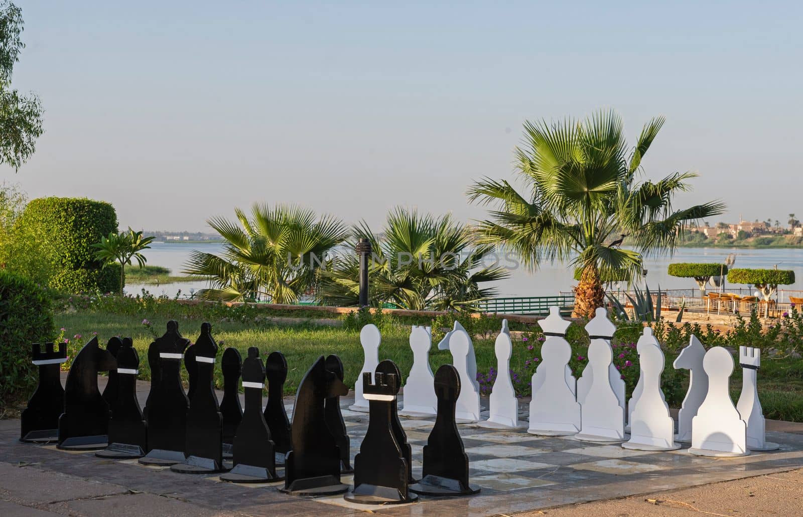 Large chess set outdoor in luxury hotel resort by paulvinten