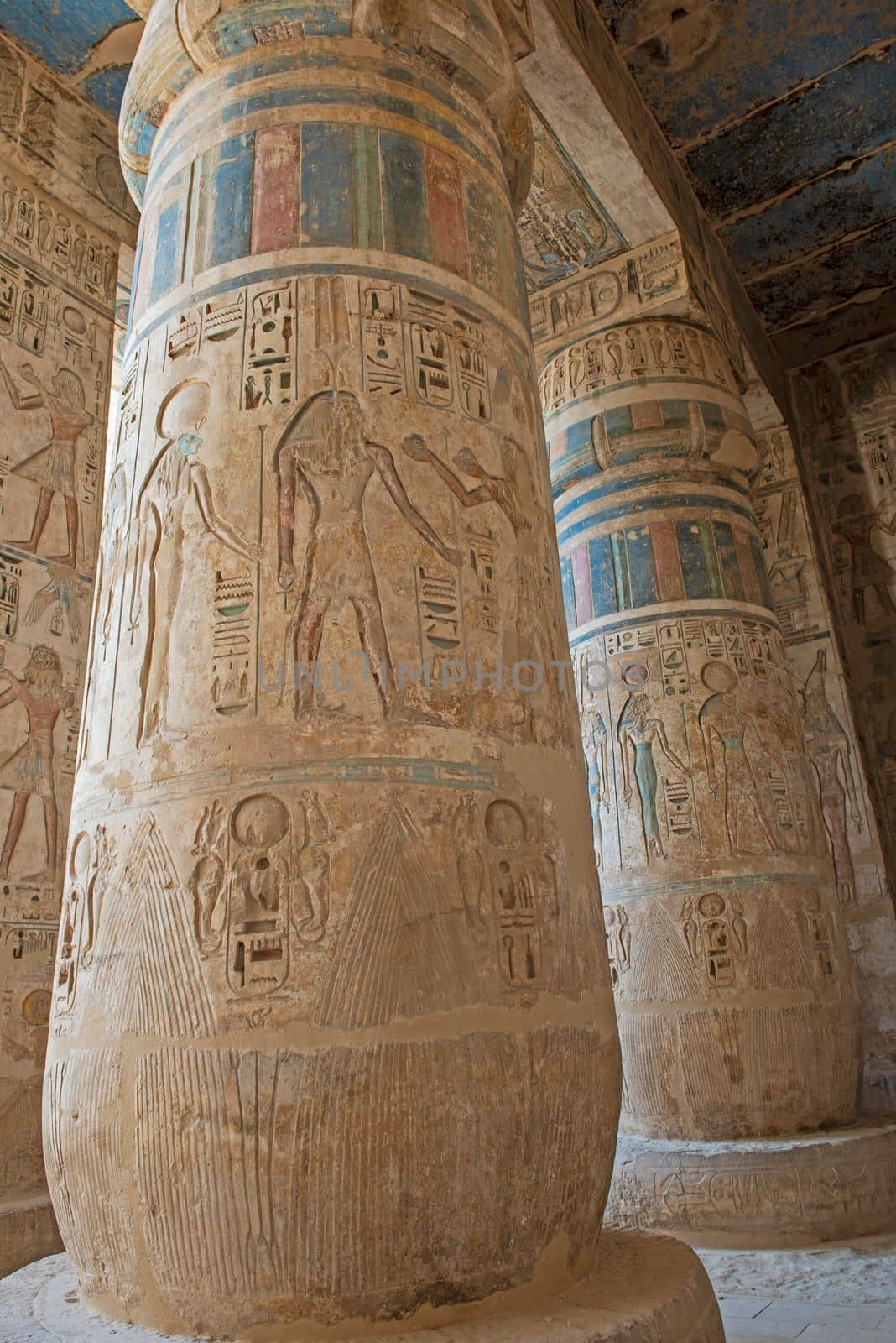 Hieroglypic carvings on columns at the ancient egyptian Medinat Habu Temple in Luxor Egypt