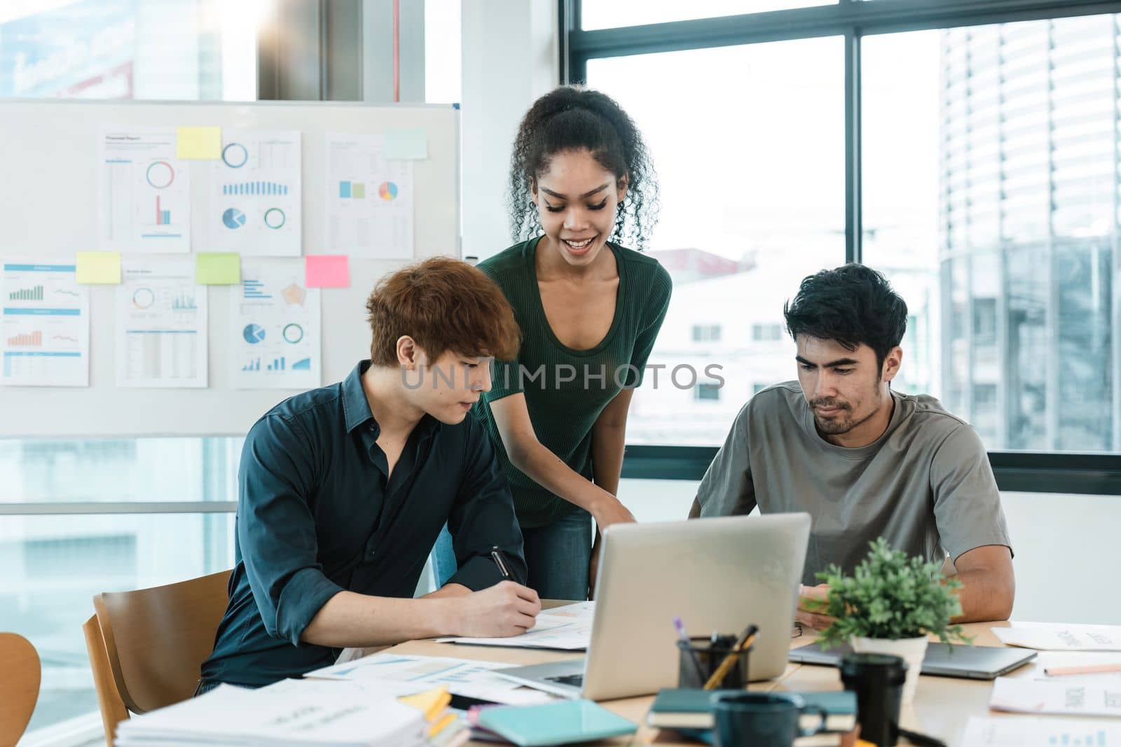 Young asian people having business meeting in office. teamwork brainstorming planning meeting concept.