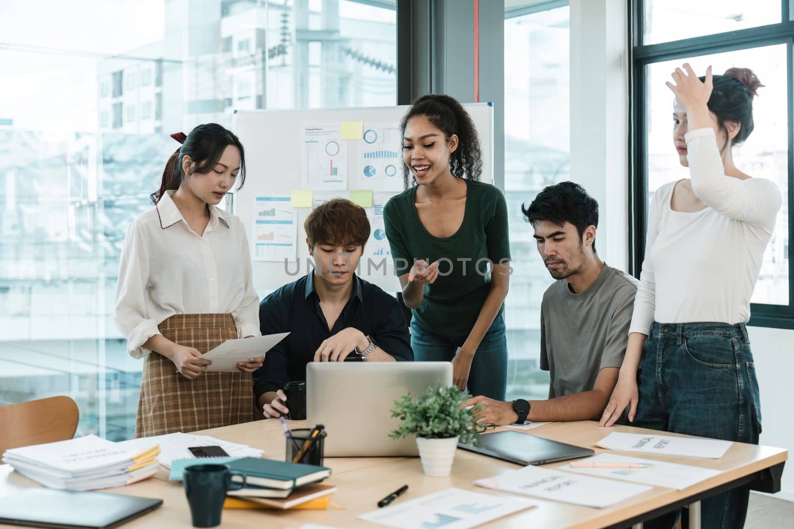 Young asian people having business meeting in office. teamwork brainstorming planning meeting concept.