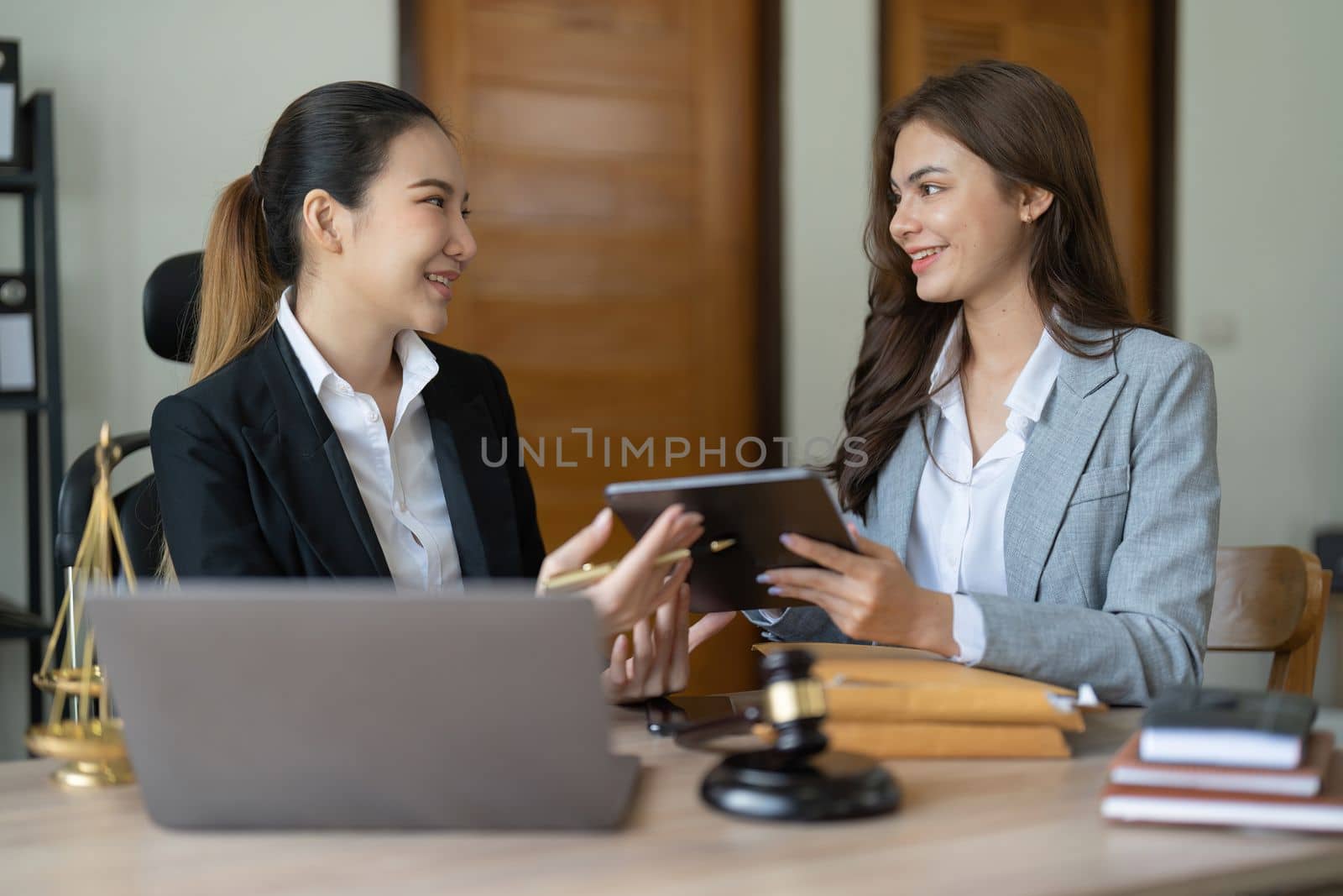 Judge gavel with client negotiation or discussion lawyer lawsuit bankruptcy of business notary consultant concept.