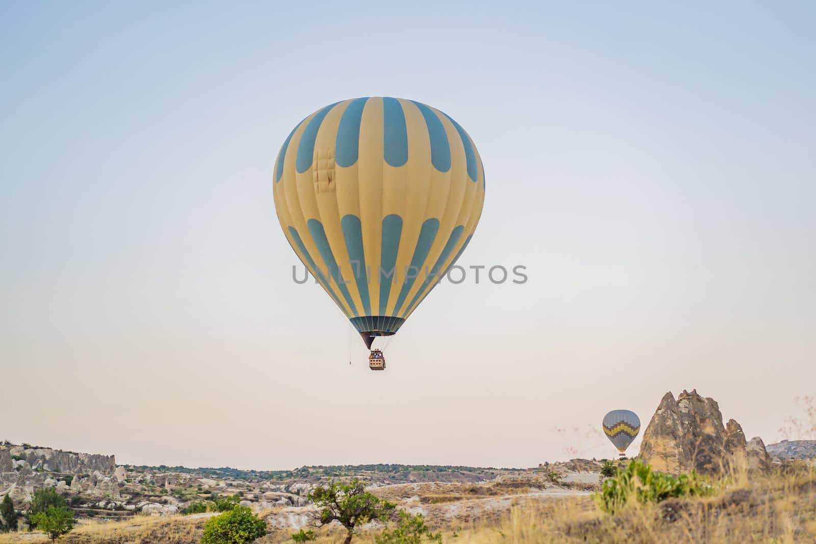 Colorful hot air balloon flying over Cappadocia, Turkey.