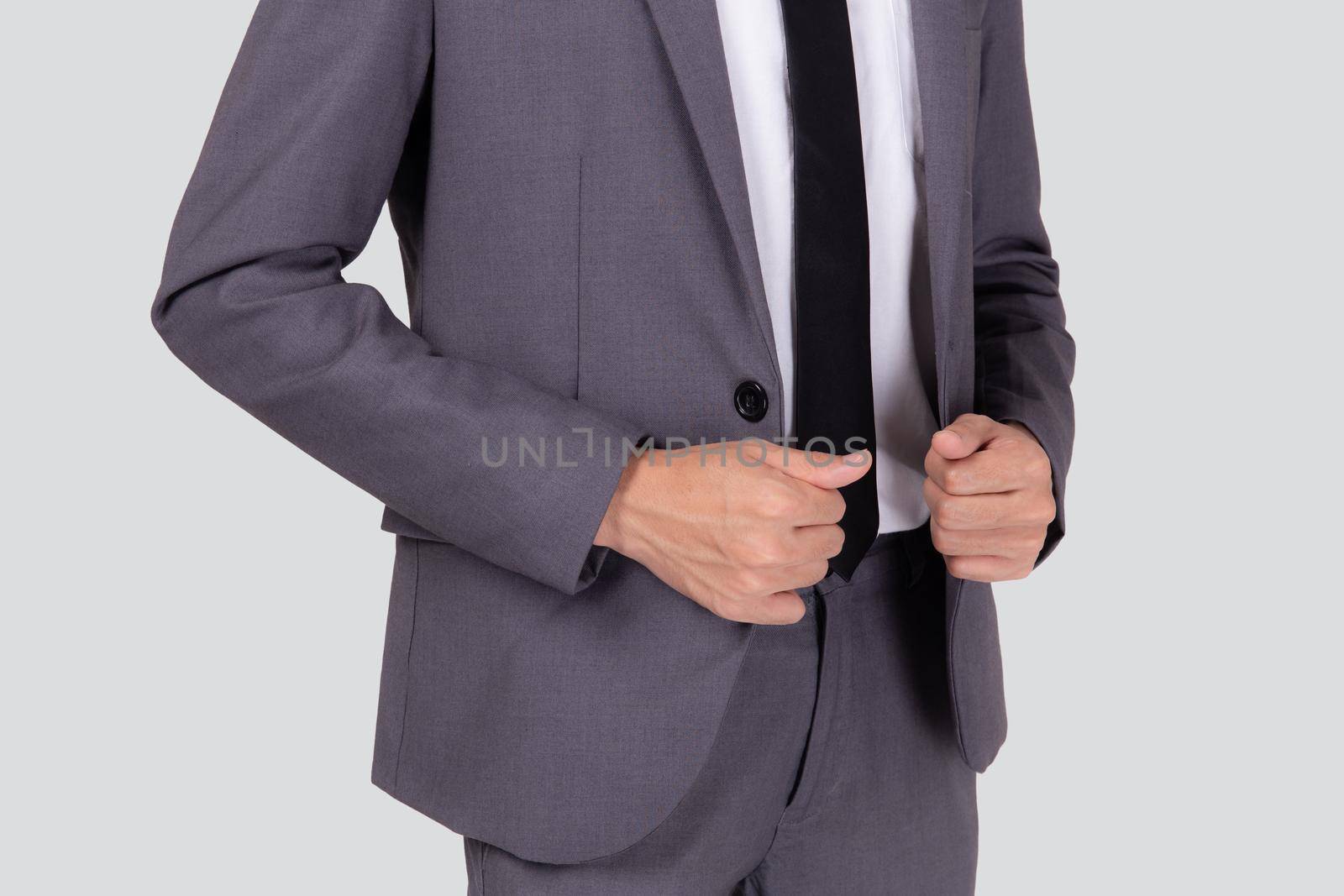 Closeup young asian businessman in suit with confident and friendly isolated on white background, business man smart with success, manager or executive with handsome and leadership. by nnudoo