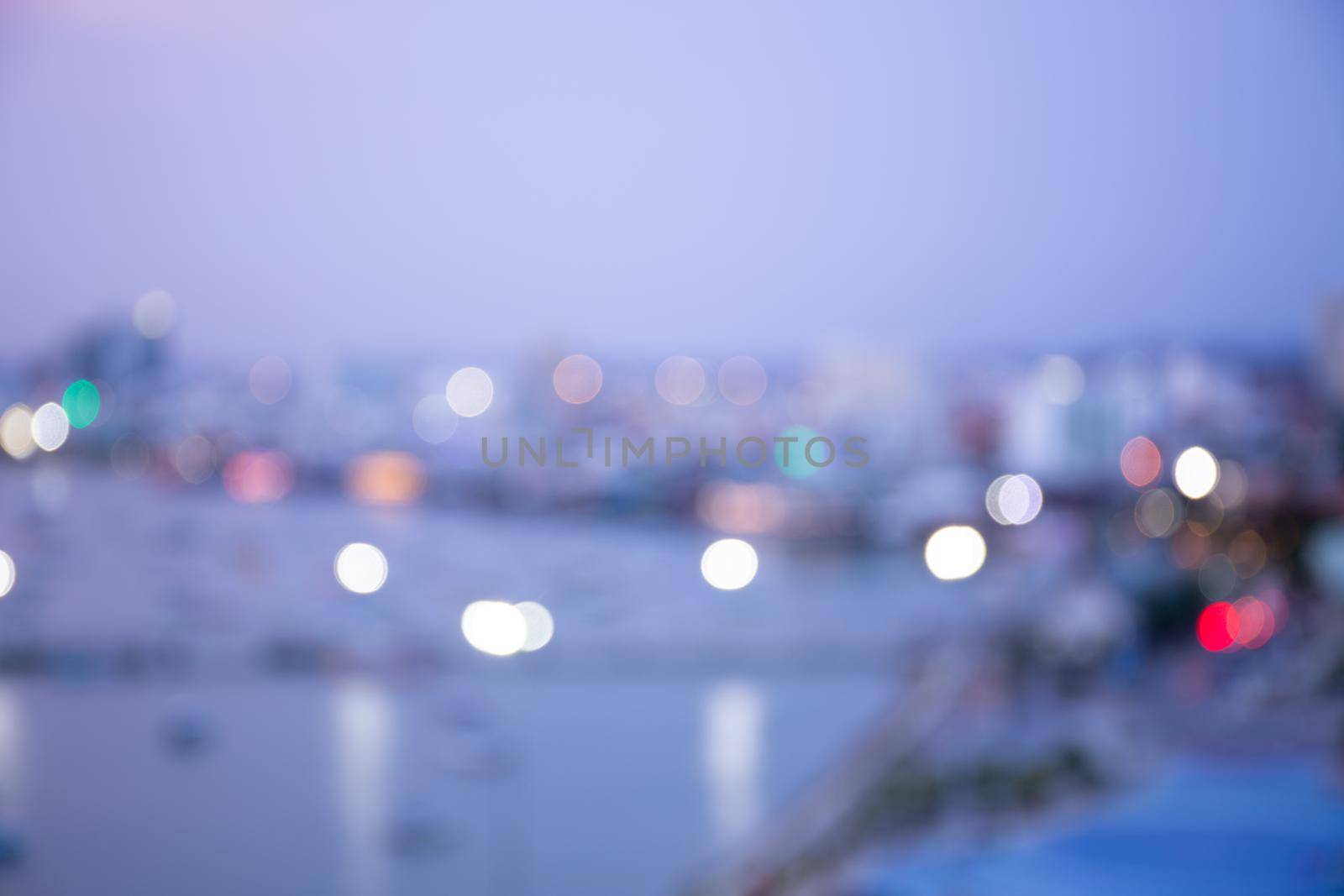 Blur bokeh background with cityscape in twilight, blurred focus in evening with downtown, landscape, illuminated and light. by nnudoo
