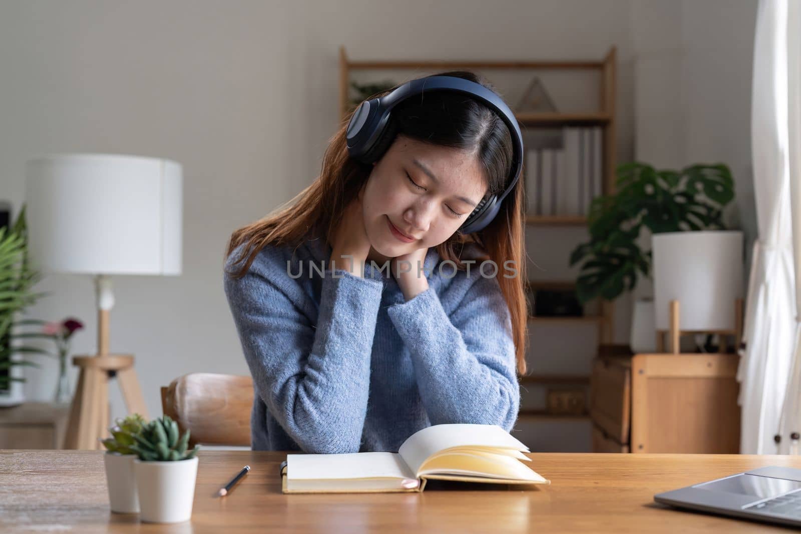 Beautiful young student woman, resting after online education, lecture or webinar