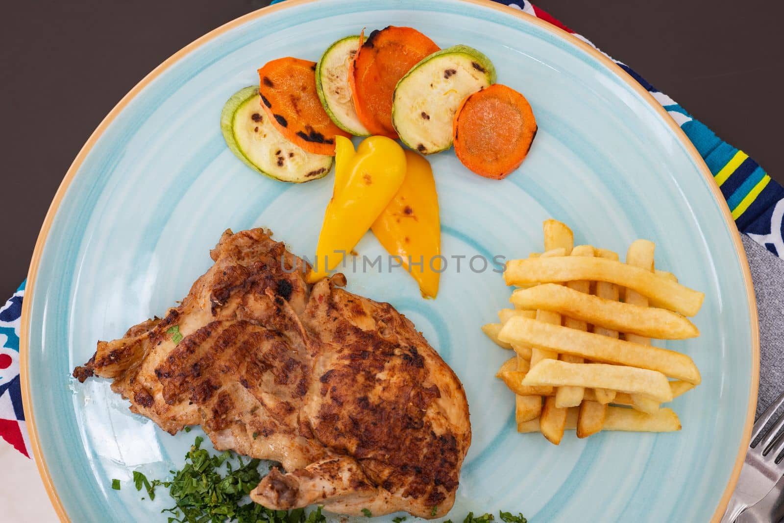 Beef steak a la carte meal with chips and vegetables by paulvinten