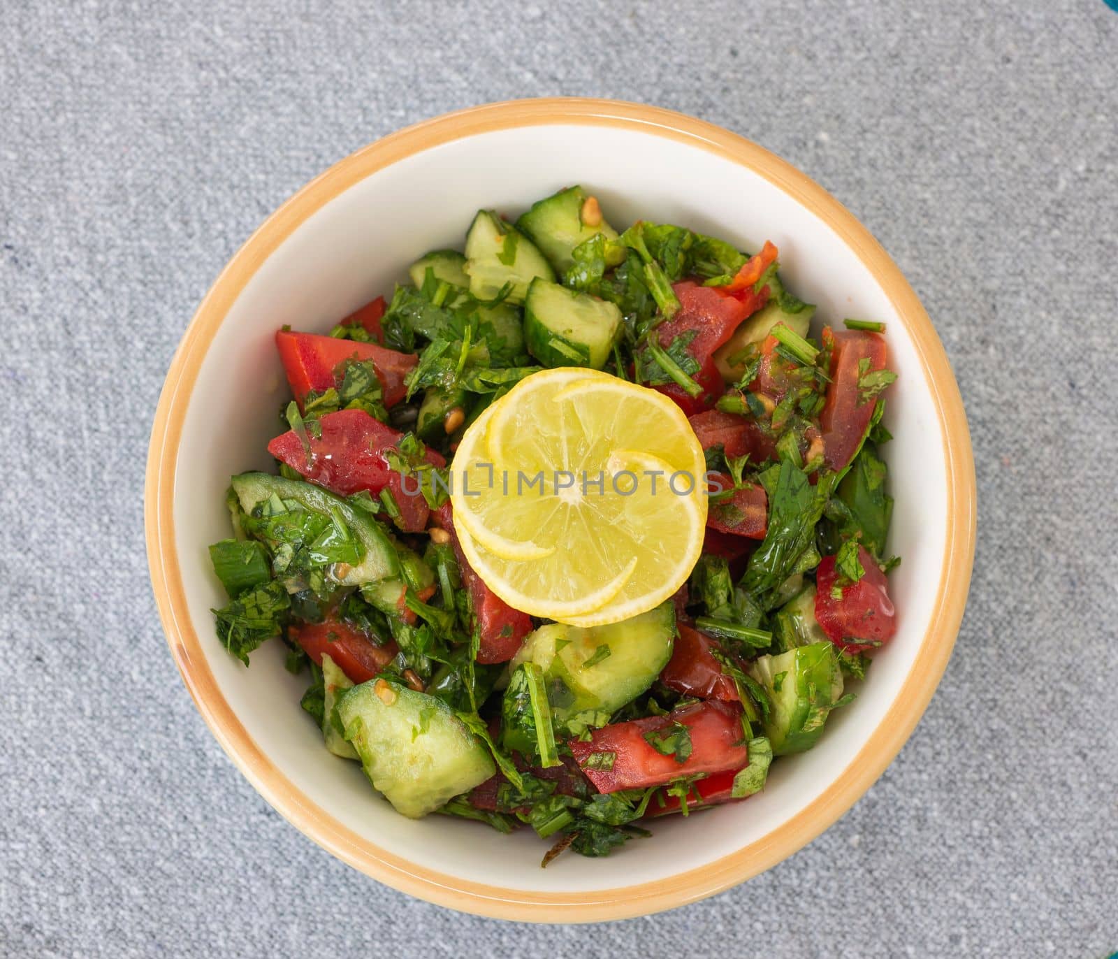 Mixed salad with lemon in a dish by paulvinten