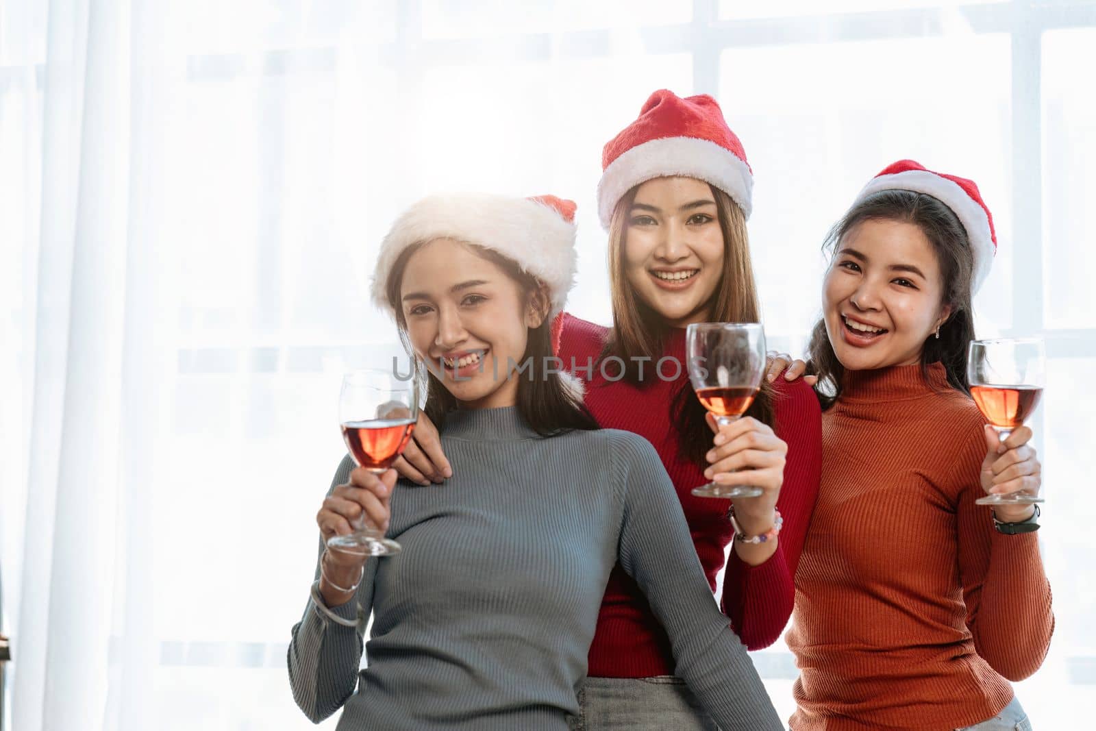 Christmas party cheerful young friends with champagne.