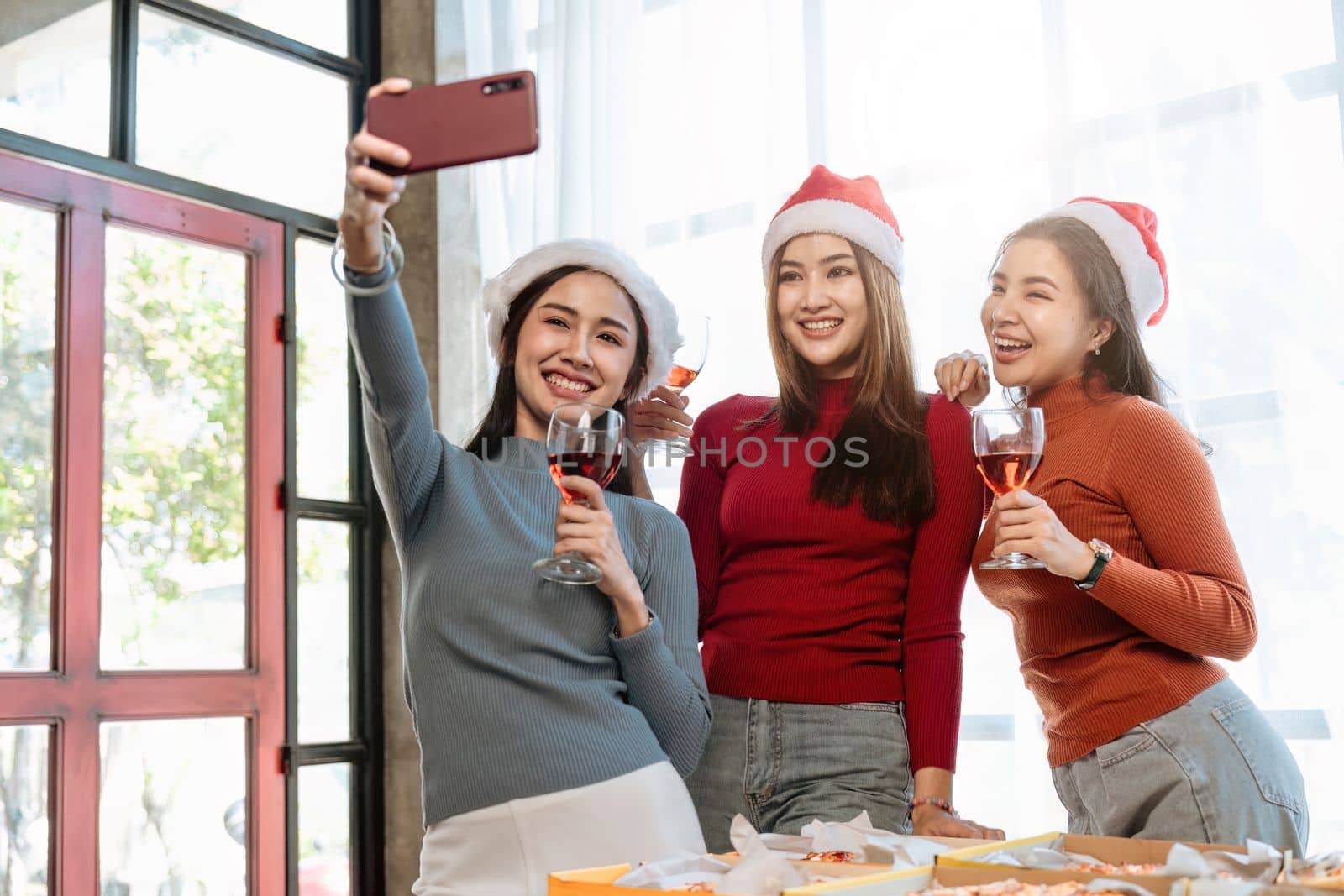 Christmas party cheerful young friends with champagne.