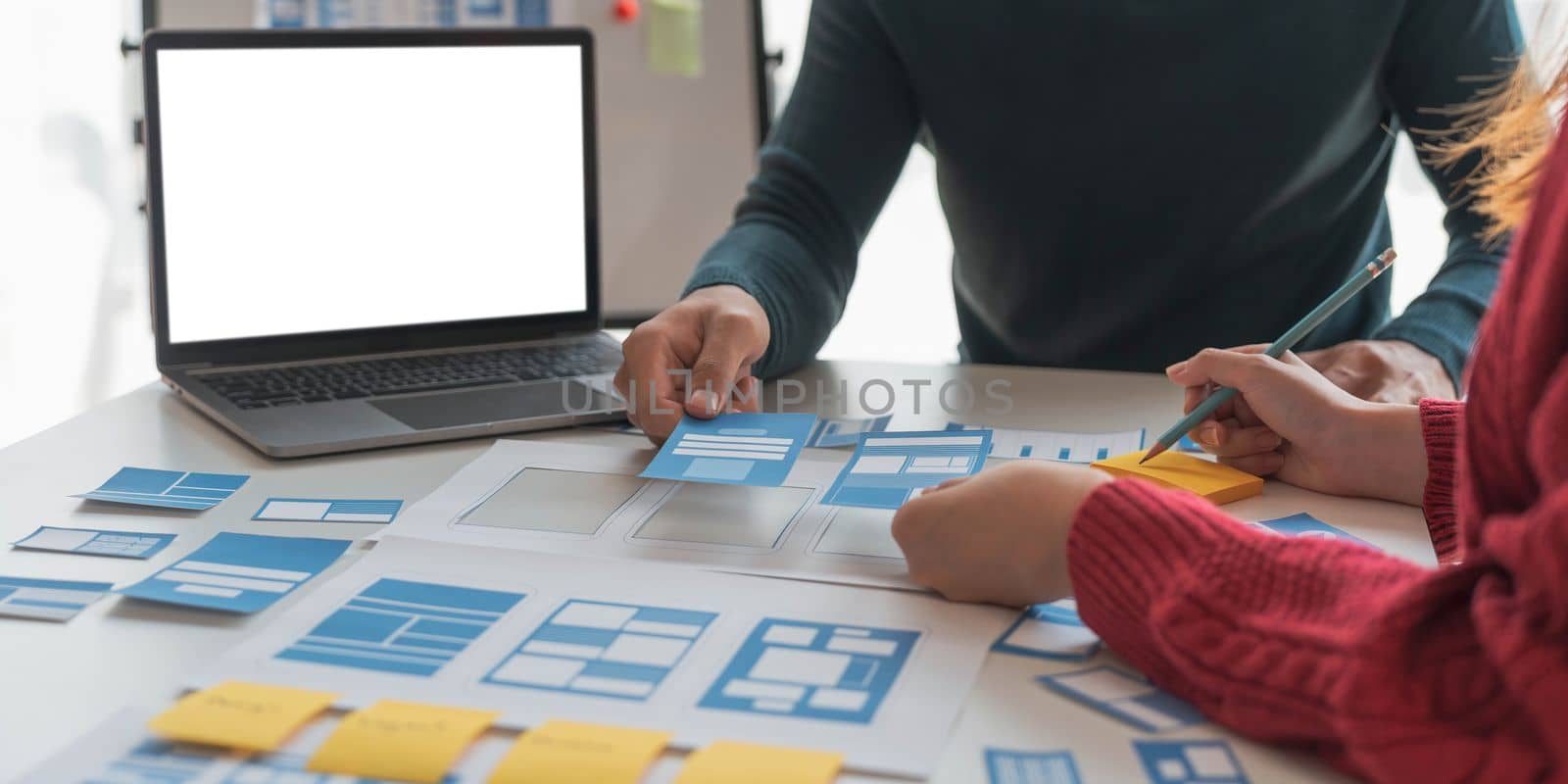 Brainstorming Group of people Working Concept. Business team brainstorming. Marketing plan researching. Paperwork on the table, laptop and mobile phone