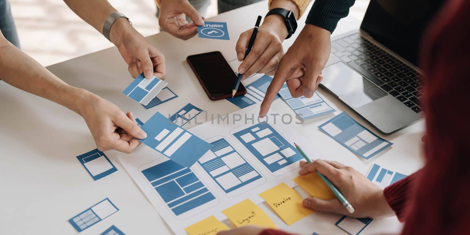 Young Asian business creative team work together, mobile application software design project. Brainstorm meeting, internet technology, smartphone web app designer, office coworker teamwork concept by wichayada
