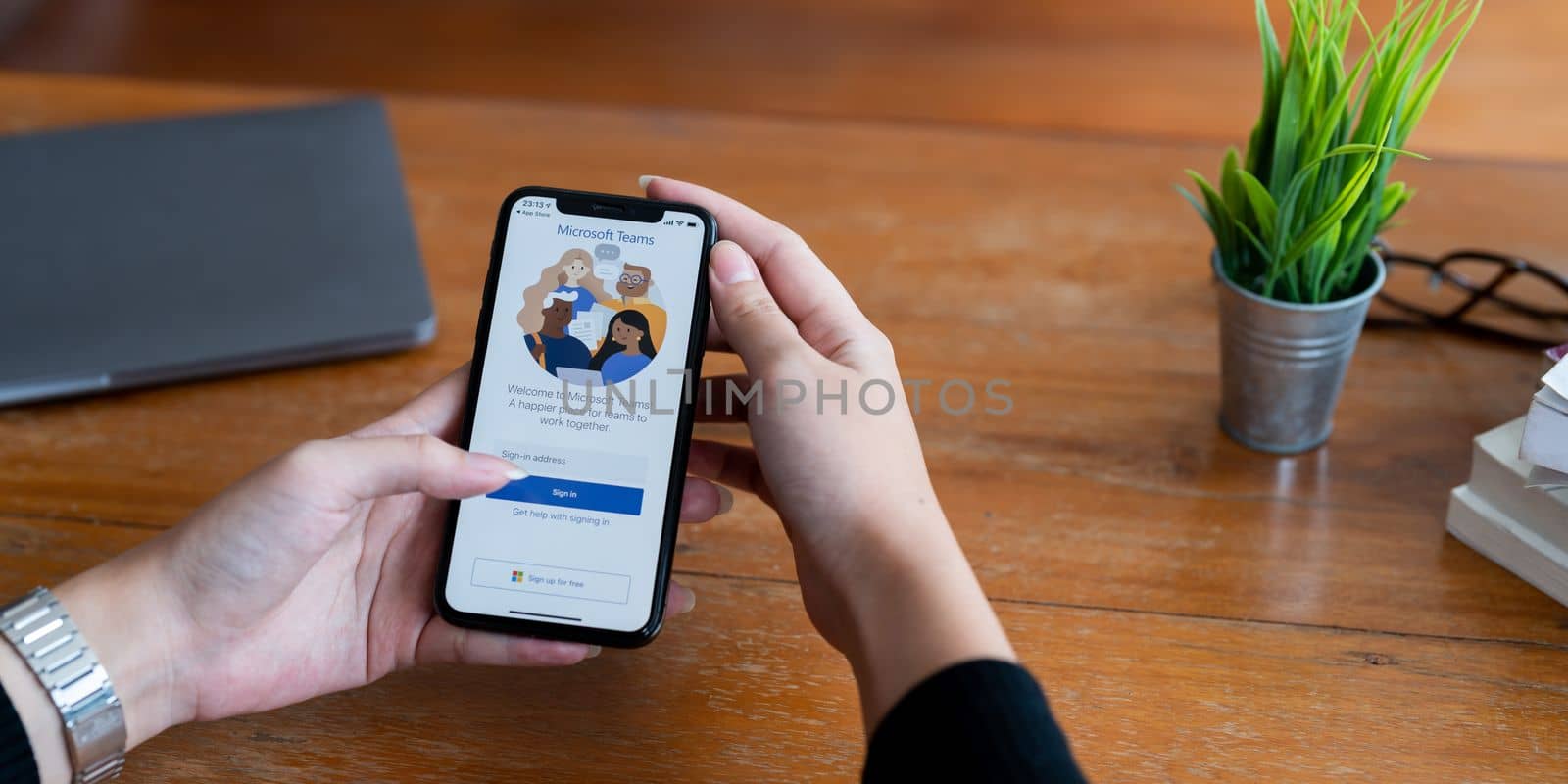 CHIANG MAI, THAILAND - JUN 29, 2022 : A working from home employee is downloading the Microsoft Teams social platform, ready for remote working in isolation from home by nateemee