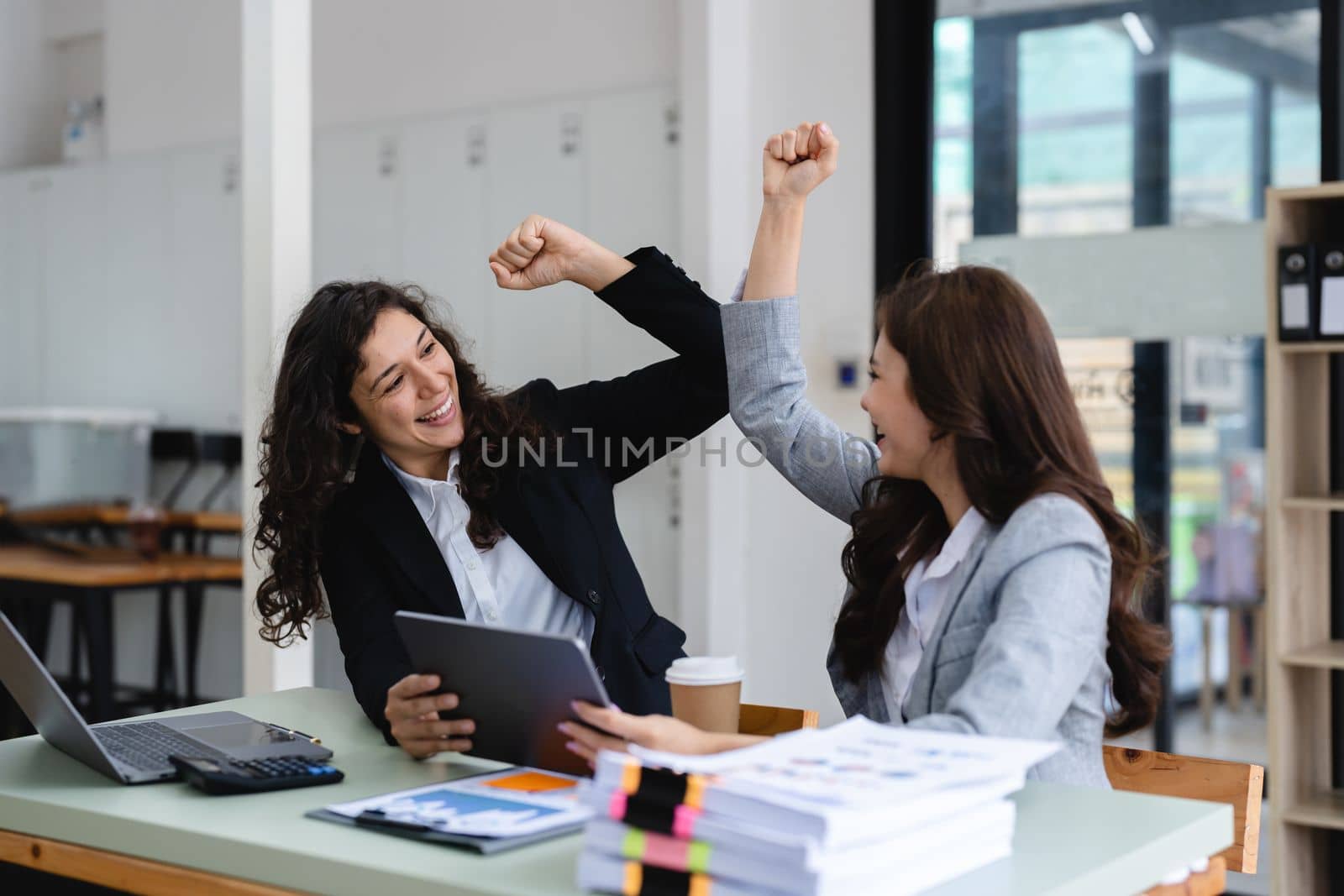 Group of diverse young business team creative businesspeople coworker in office Happy to be successful partnership teamwork celebrating achievement and success concept