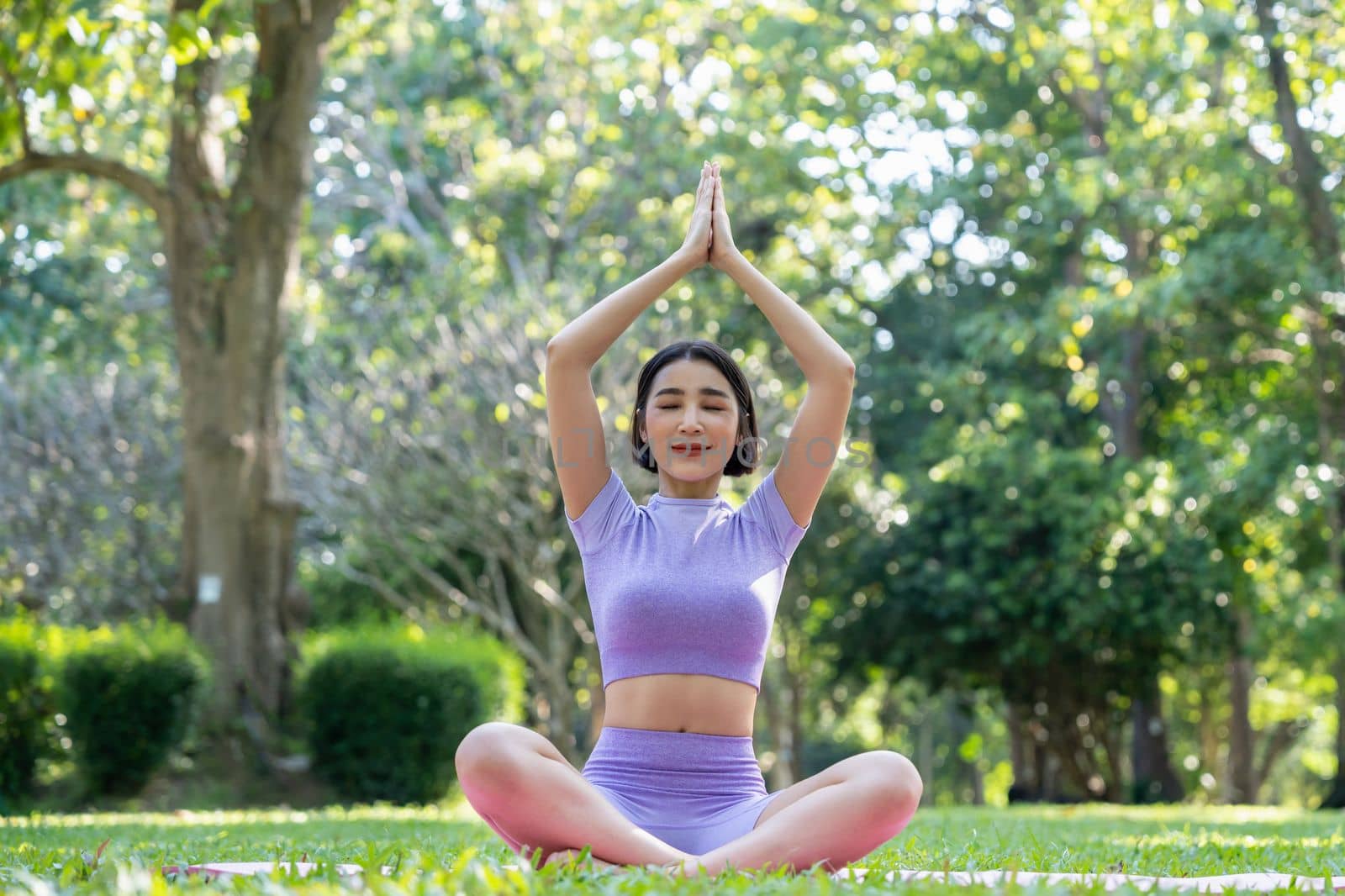 Lifestyle woman yoga exercise and pose for healthy life. Young girl pose balance body vital zen meditation for workout nature in morning sunrise with mat outdoor. by nateemee