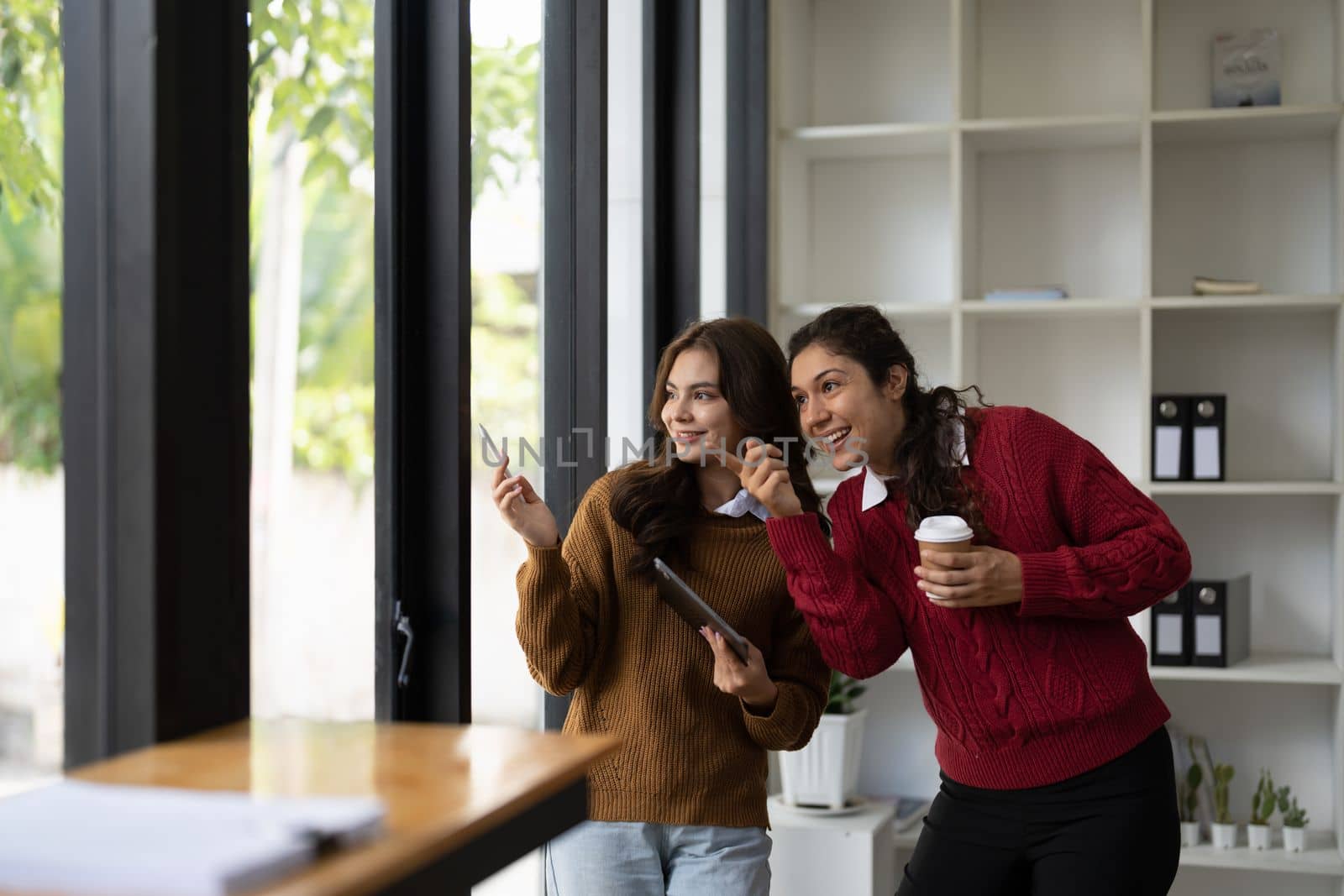 Diversity young women working with digital tablet in office