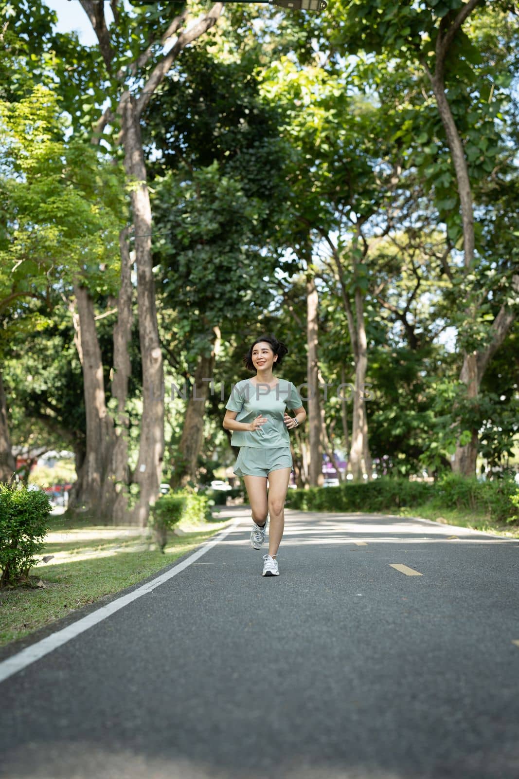 Asian woman runners. She was running on the park in the morning