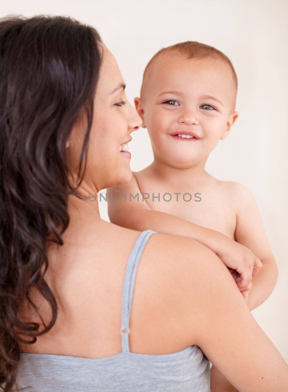 Just me and my baby. a beautiful young woman and her baby at home. by YuriArcurs