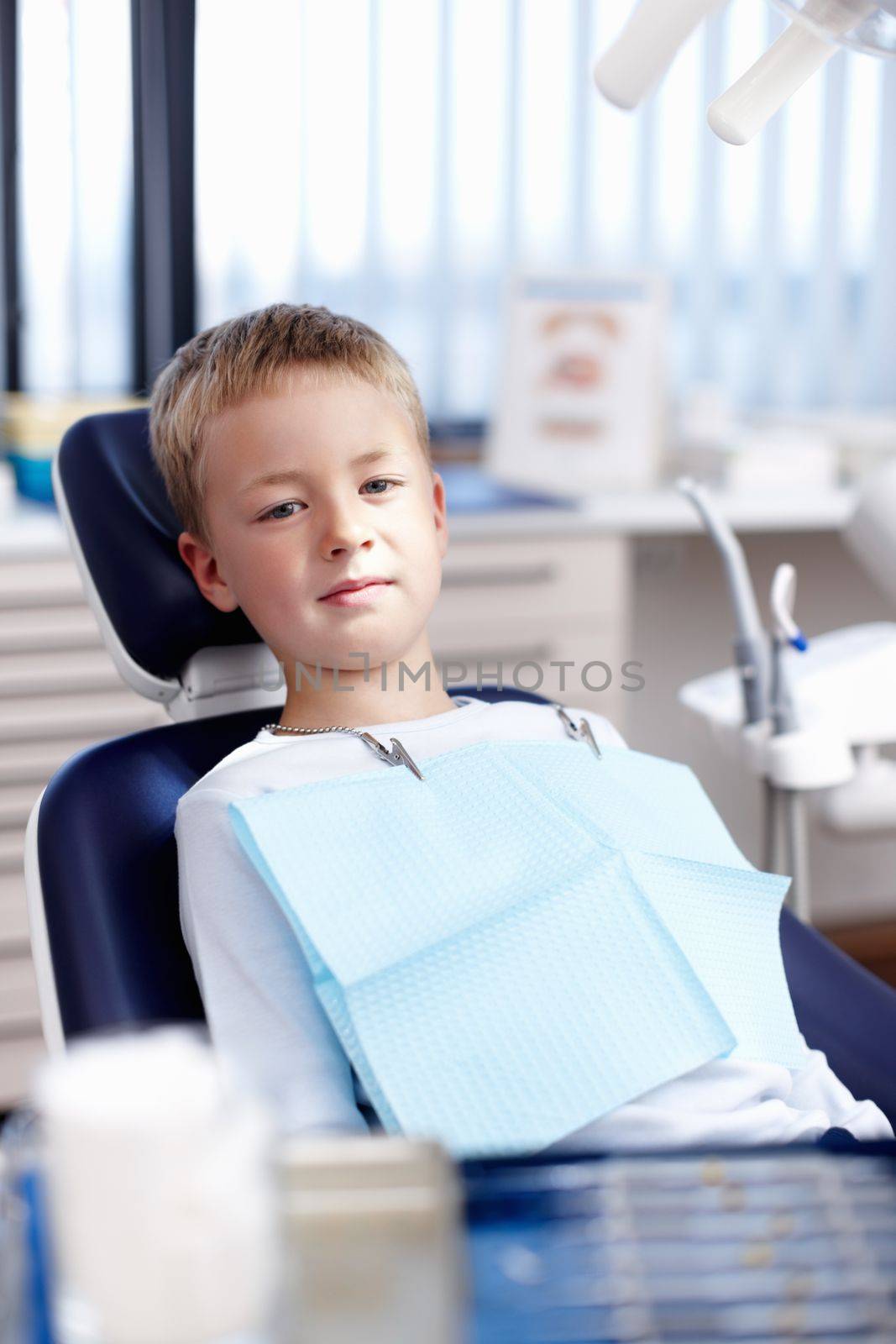 Child at dentist. Portrait of innocent small child at dentist office