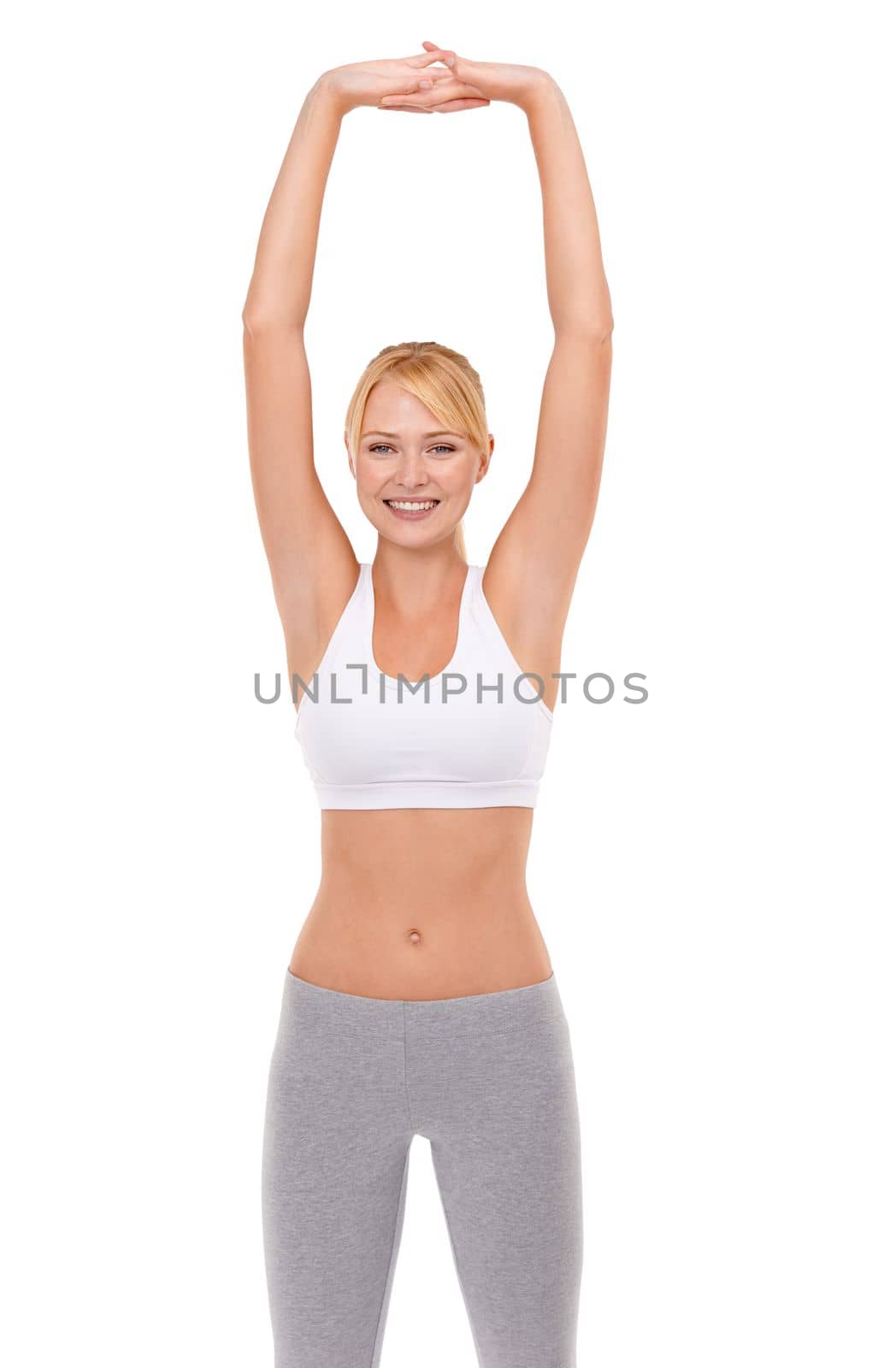 Its important to warm up and stretch. an attractive young woman in sports clothing doing some stretching