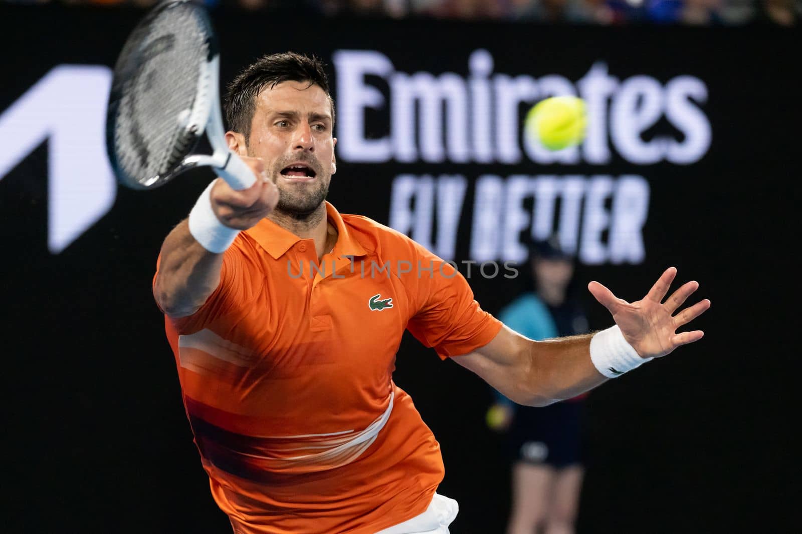MELBOURNE, AUSTRALIA - JANUARY 13: Novak Djokovic of Serbia hits a shot to Nick Kyrgios of Australia in an Arena Showdown charity match ahead of the 2023 Australian Open at Melbourne Park on January 13, 2023 in Melbourne, Australia.