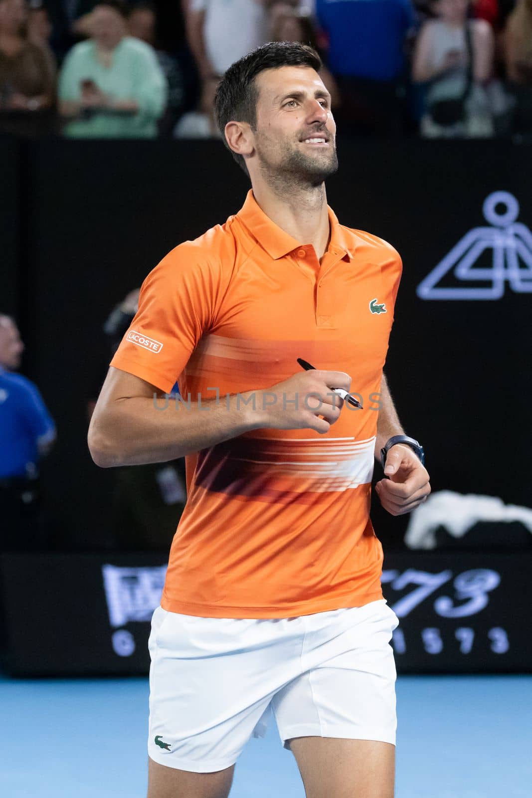 MELBOURNE, AUSTRALIA - JANUARY 13: Novak Djokovic of Serbia signs autographs after playing Nick Kyrgios of Australia in a showdown charity match ahead of the 2023 Australian Open at Melbourne Park on January 13, 2023 in Melbourne, Australia.