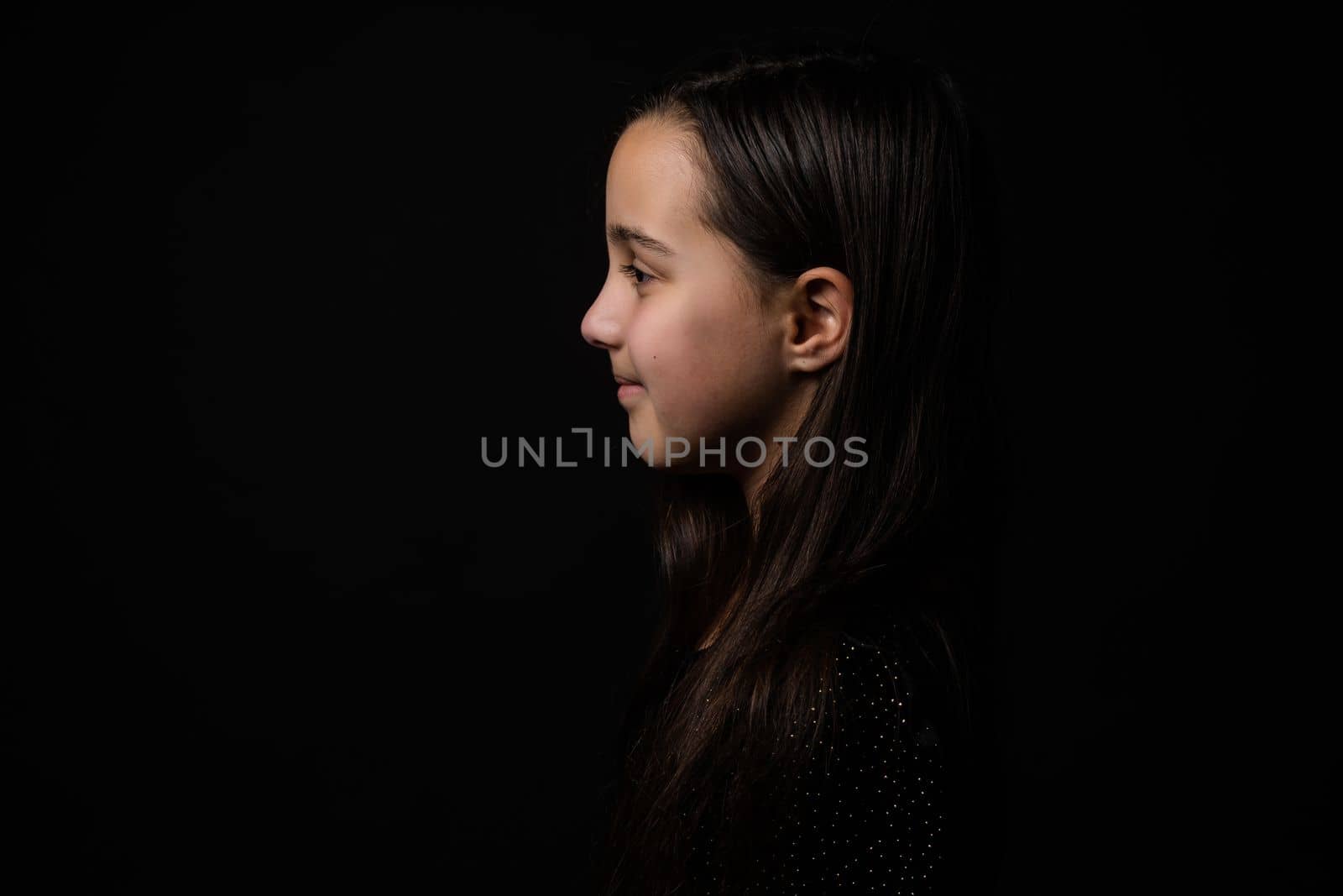 portrait of a child close-up, little girl on a black background by Andelov13