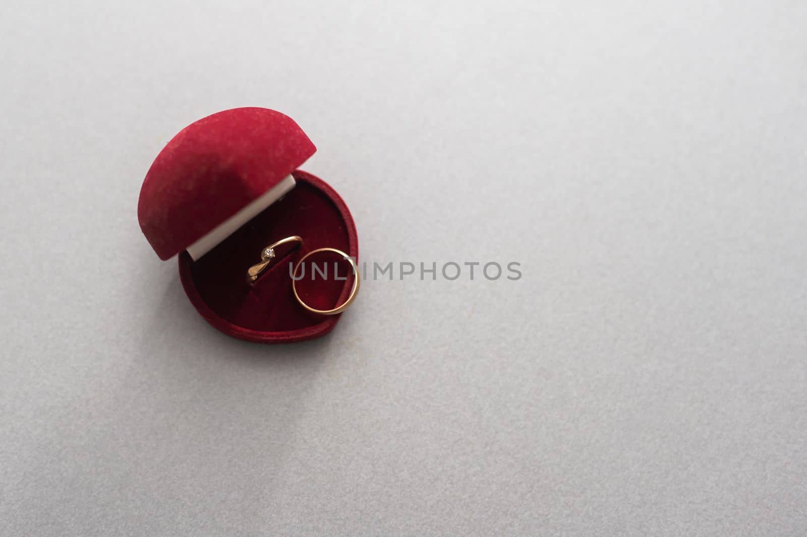 Two wedding rings in nice red box isolated on white background